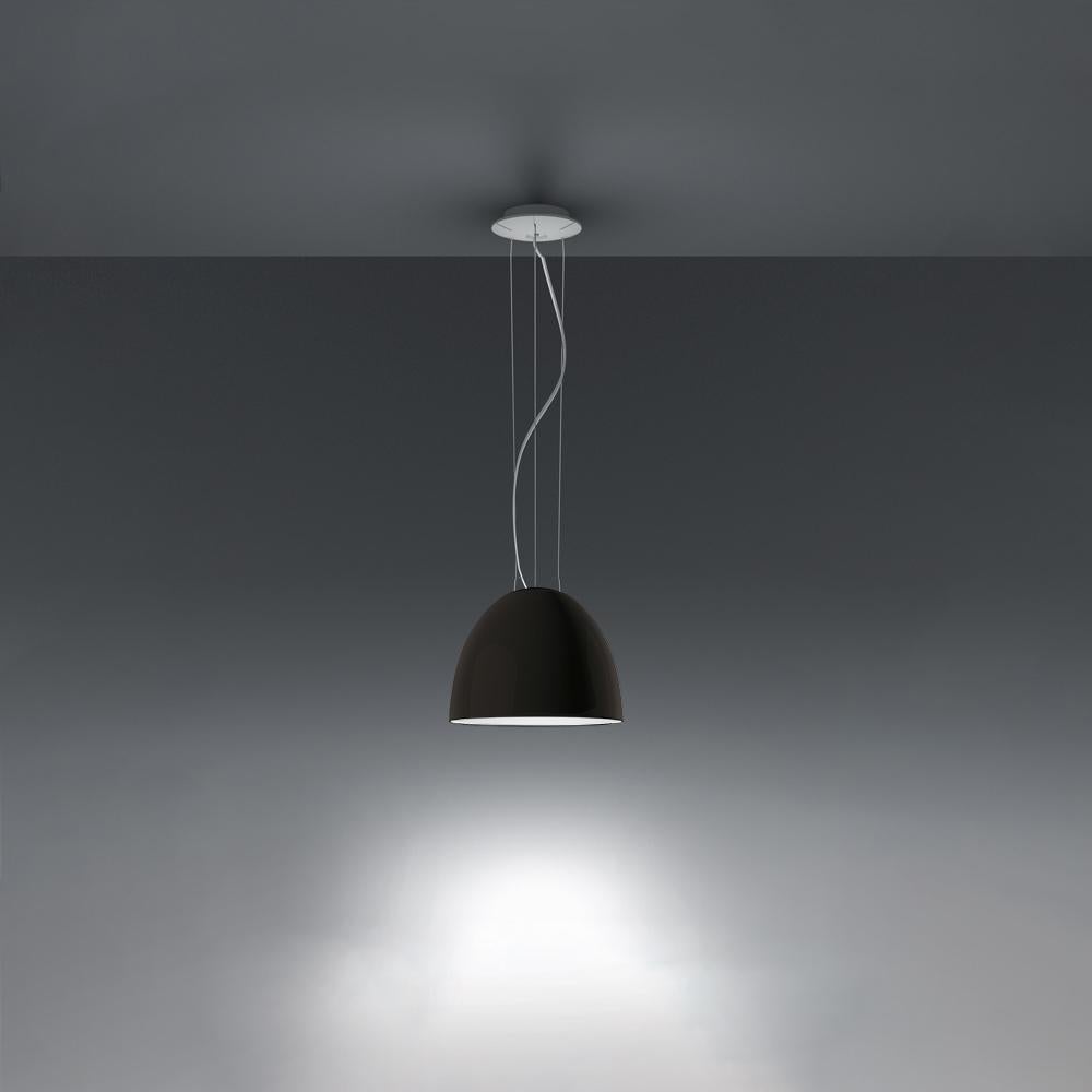 A system for the metamorphosis of light, Nur Suspension has a sleek, contemporary dome shape that provides direct downlighting, with a sanded glass top that also allows a softer, more subtle diffused light to escape. 
Nur creates indirect light