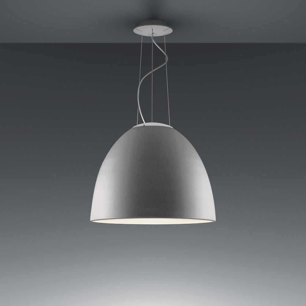 A system for the metamorphosis of light, Nur suspension has a sleek, contemporary dome shape that provides direct downlighting, with a sanded glass top that also allows a softer, more subtle diffused light to escape. Nur creates indirect light