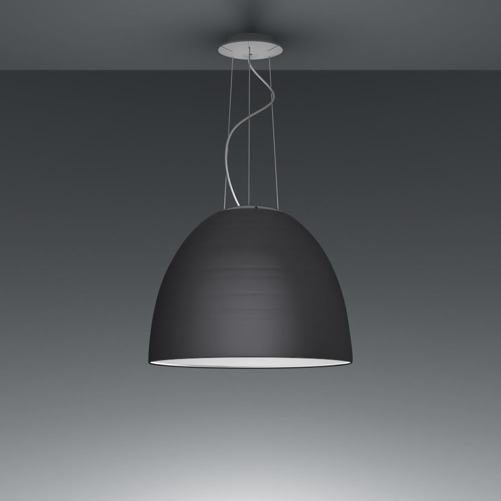 A system for the metamorphosis of light, Nur Suspension has a sleek, contemporary dome shape that provides direct downlighting, with a sanded glass top that also allows a softer, more subtle diffused light to escape. Nur creates indirect light