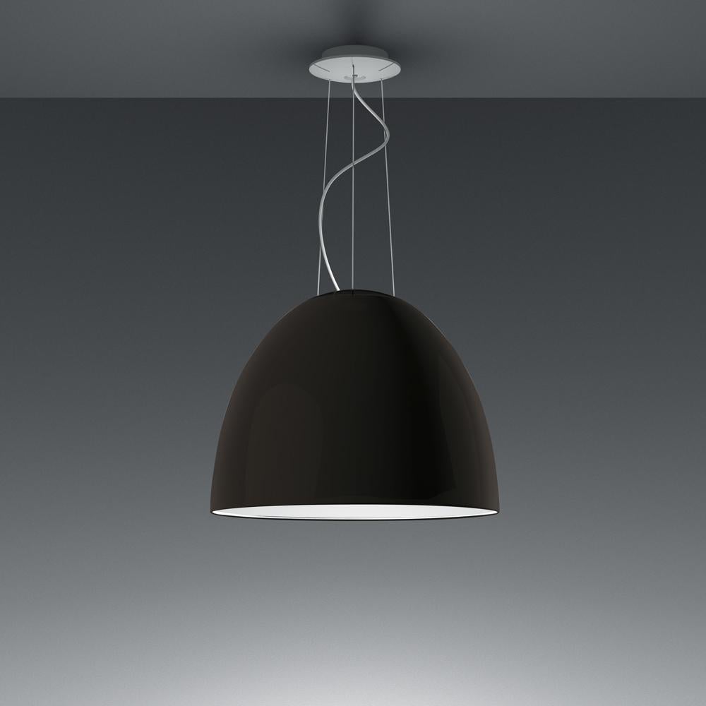A system for the metamorphosis of light, Nur Suspension has a sleek, contemporary dome shape that provides direct downlighting, with a sanded glass top that also allows a softer, more subtle diffused light to escape. Nur creates indirect light