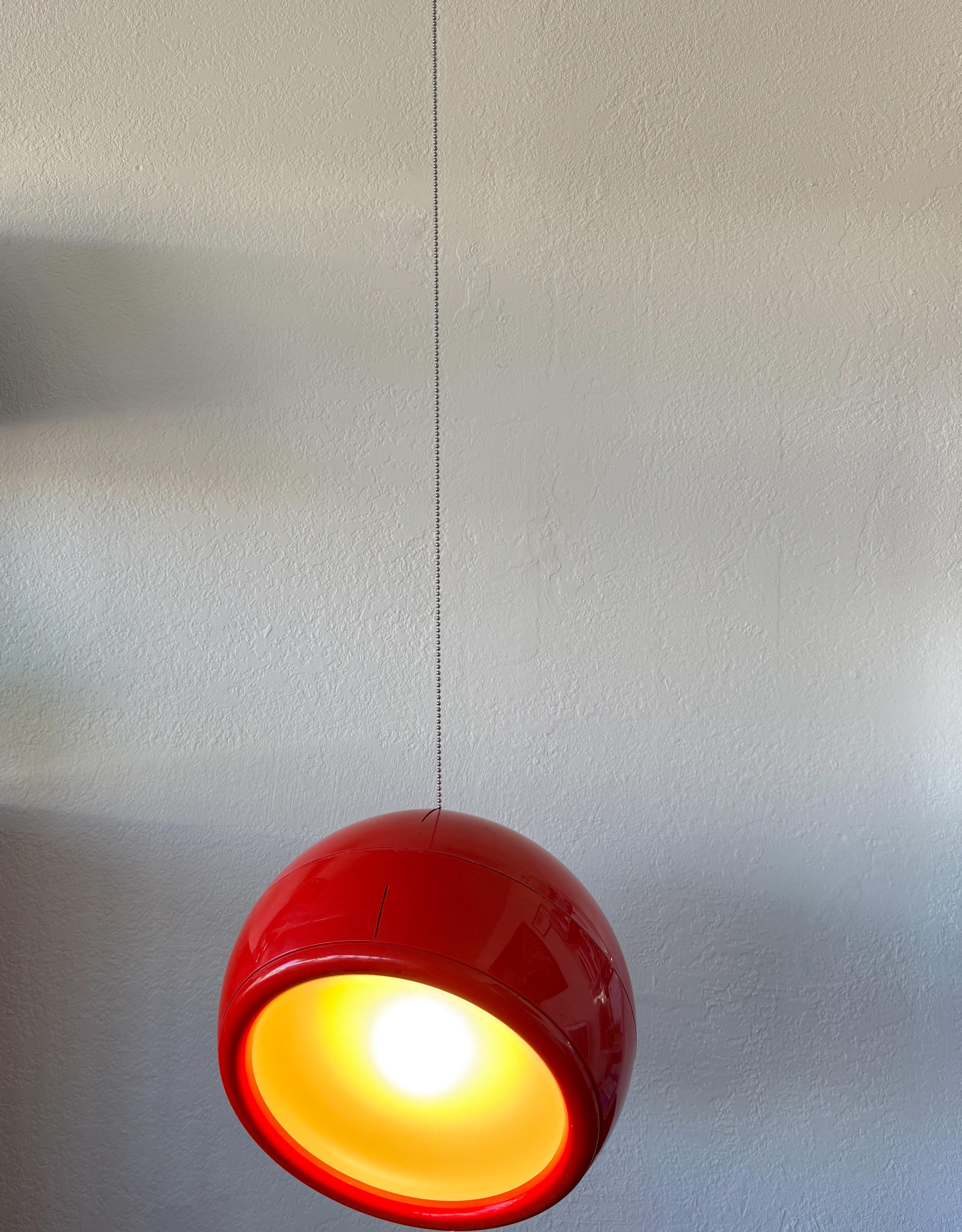 1960’s Italian Red Artemide 'Pallade' hanging lamp by Studio Tetrarch. 
In original vintage condition shows some scratches on red plastic. 
Can be used as a pendant or table lamp. 
Wire for US. 

Measurements: 15” Diameter, 12” High. 