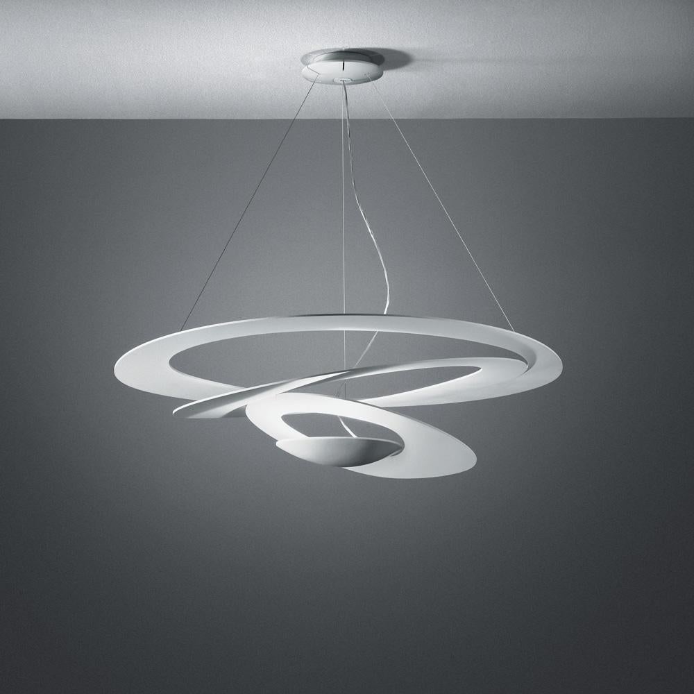 Spirals gently descend delivering sculptural light effects. Painted aluminum body in white or black. Full size, mini and micro for wall, ceiling and suspension.

Integrated light source. Only available in the United States.