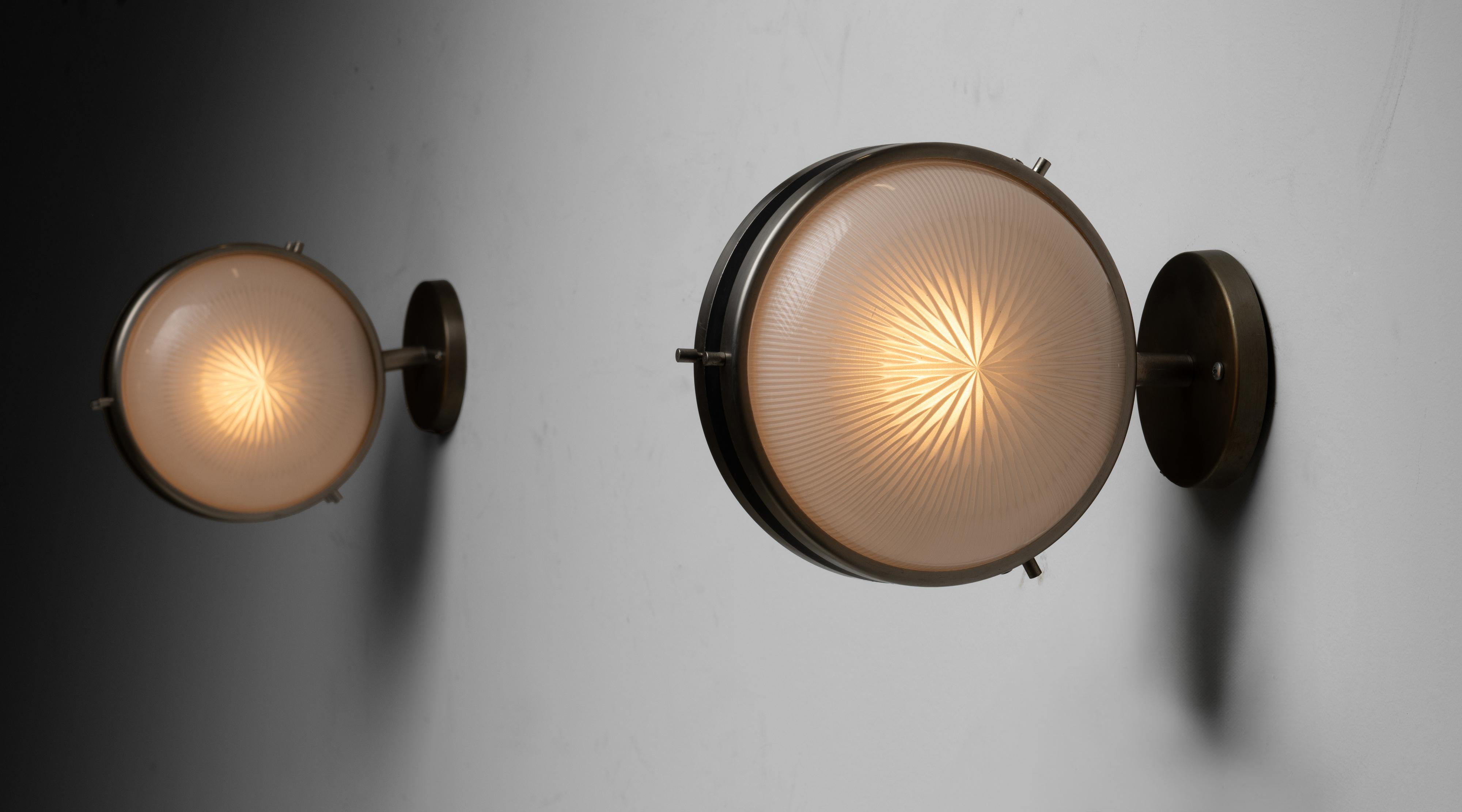 Artemide Sconces by Sergio Mazza
Italy circa 1960
Nickeled and black enameled brass with two pressed opaline glass diffusers. Designed by Sergio Mazza.
5”w x 9.5”d x 8”h