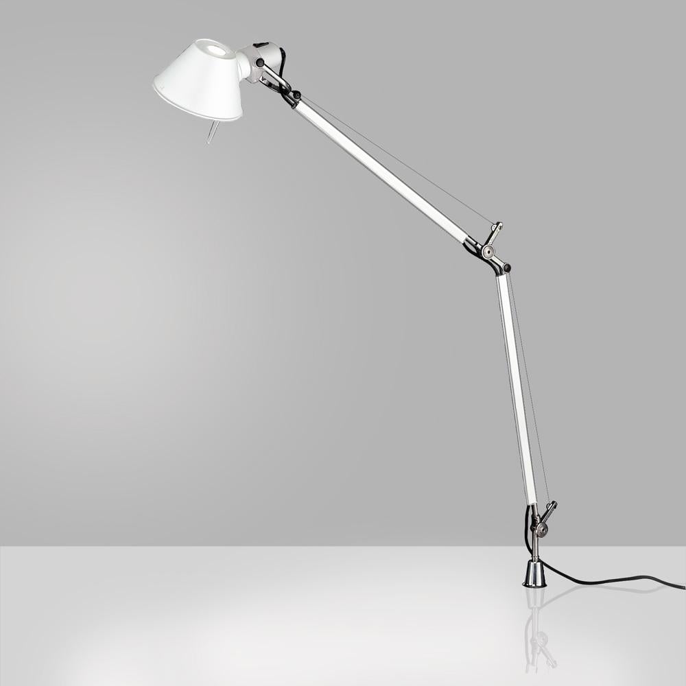 “No desk lamp should make you use two hands to position it.” - Michele De Lucchi. A study in balance and movement, the Tolomeo table lamp is designed for a fully adjustable direction of light. Created for Artemide in 1987 by Michele De Lucchi and