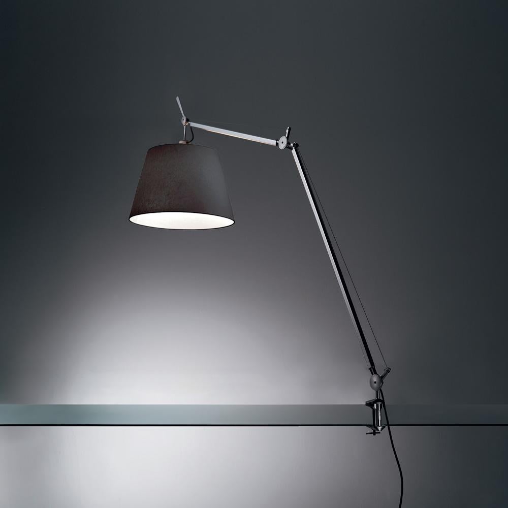 An extension to the iconic Tolomeo family, Tolomeo Mega features the same arm balancing system as the Tolomeo 12” table lamp combined with a selection of parchment or fabric shades, creating its own sub-family. Tolomeo is available in table clamp,