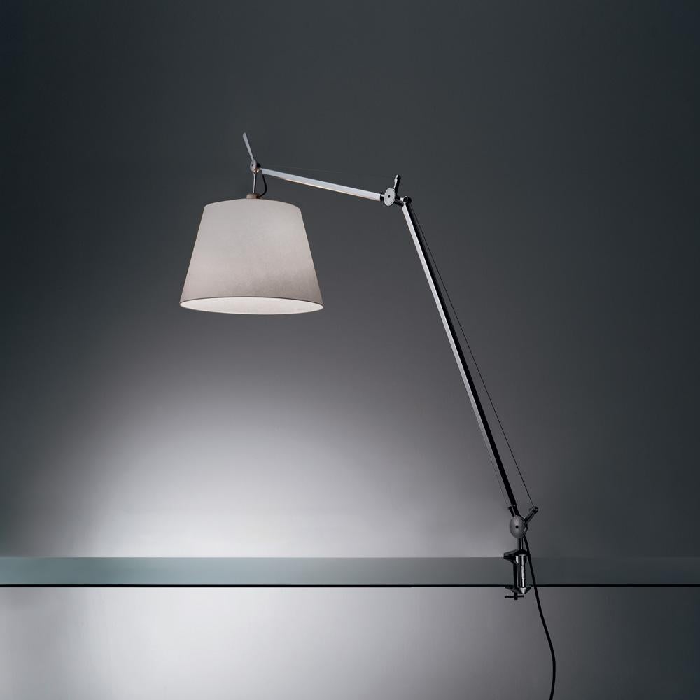 An extension to the iconic Tolomeo family, Tolomeo Mega features the same arm balancing system as the Tolomeo 14” table lamp combined with a selection of parchment or fabric shades, creating its own sub-family. Tolomeo is available in table clamp,