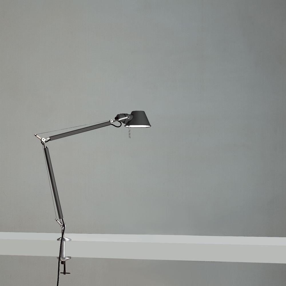 “No desk lamp should make you use two hands to position it.” Michele De Lucchi. A study in balance and movement, the Tolomeo table lamp is designed for a fully adjustable direction of light. Created for Artemide in 1987 by Michele De Lucchi and