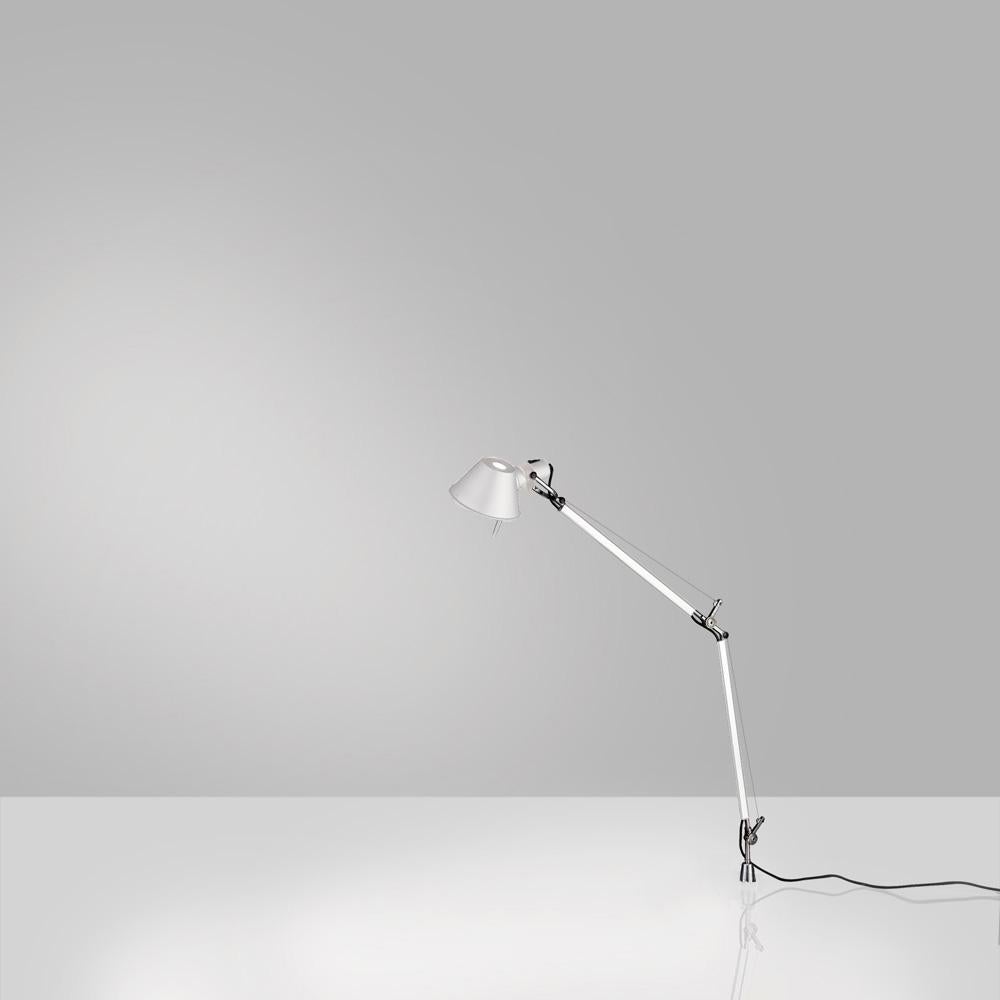 “No desk lamp should make you use two hands to position it.” Michele De Lucchi. A study in balance and movement, the Tolomeo table lamp is designed for a fully adjustable direction of light. Created for Artemide in 1987 by Michele De Lucchi and