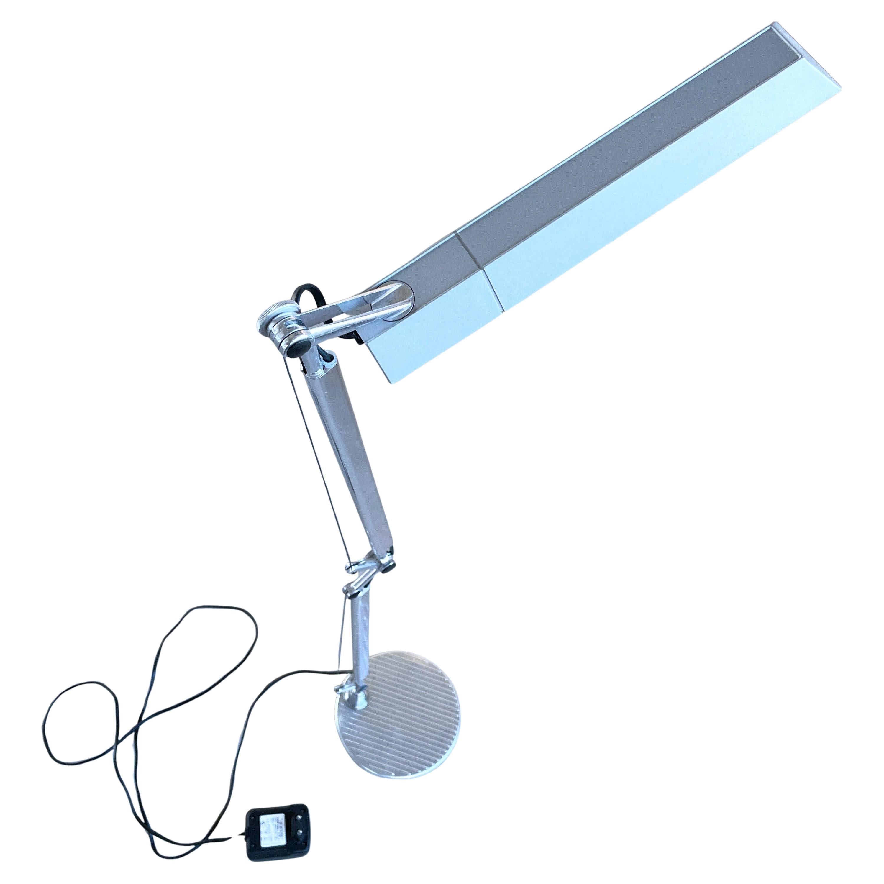 Artemide Tolomeo 'Video' Desk / Table Lamp. Designed by Michele De Lucchi and Giancarlo Fassina.
Featuring a pivoting head and articulated arm, this lamp offers a wide range of motion and flexibility. The fluorescent tube and direct light design add