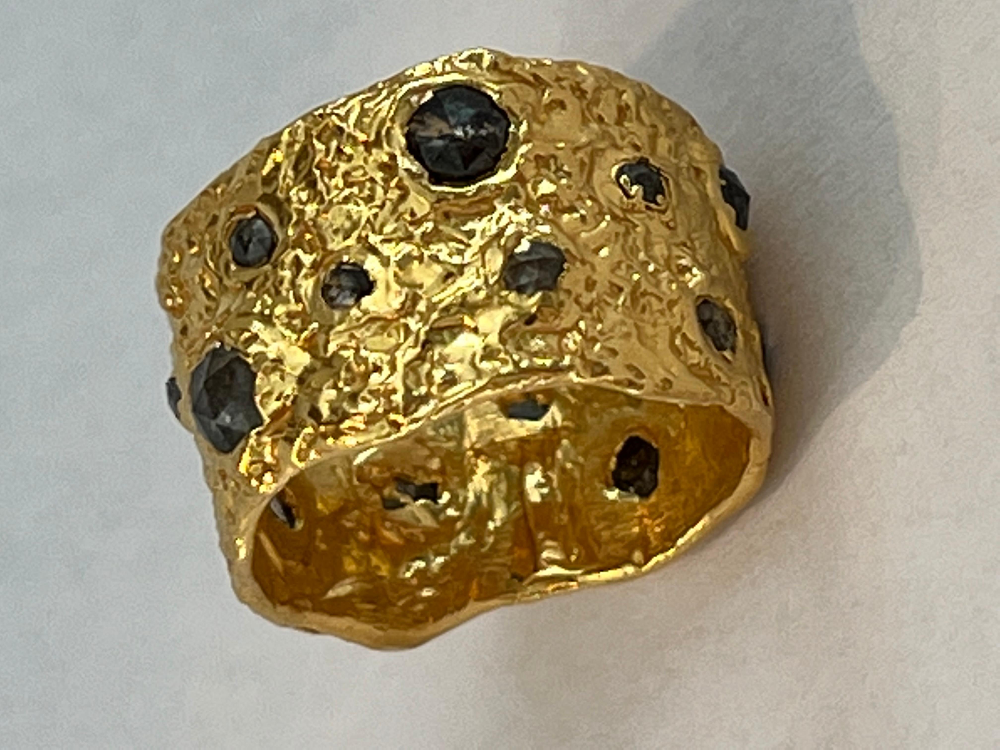 Artemis 22k gold ring features salt and pepper diamonds organically set throughout the ring. Hand made, one of a kind and complete with Tagili Designs signature finish. Part of the Goddess Collection. This collection combines the essence of a woman