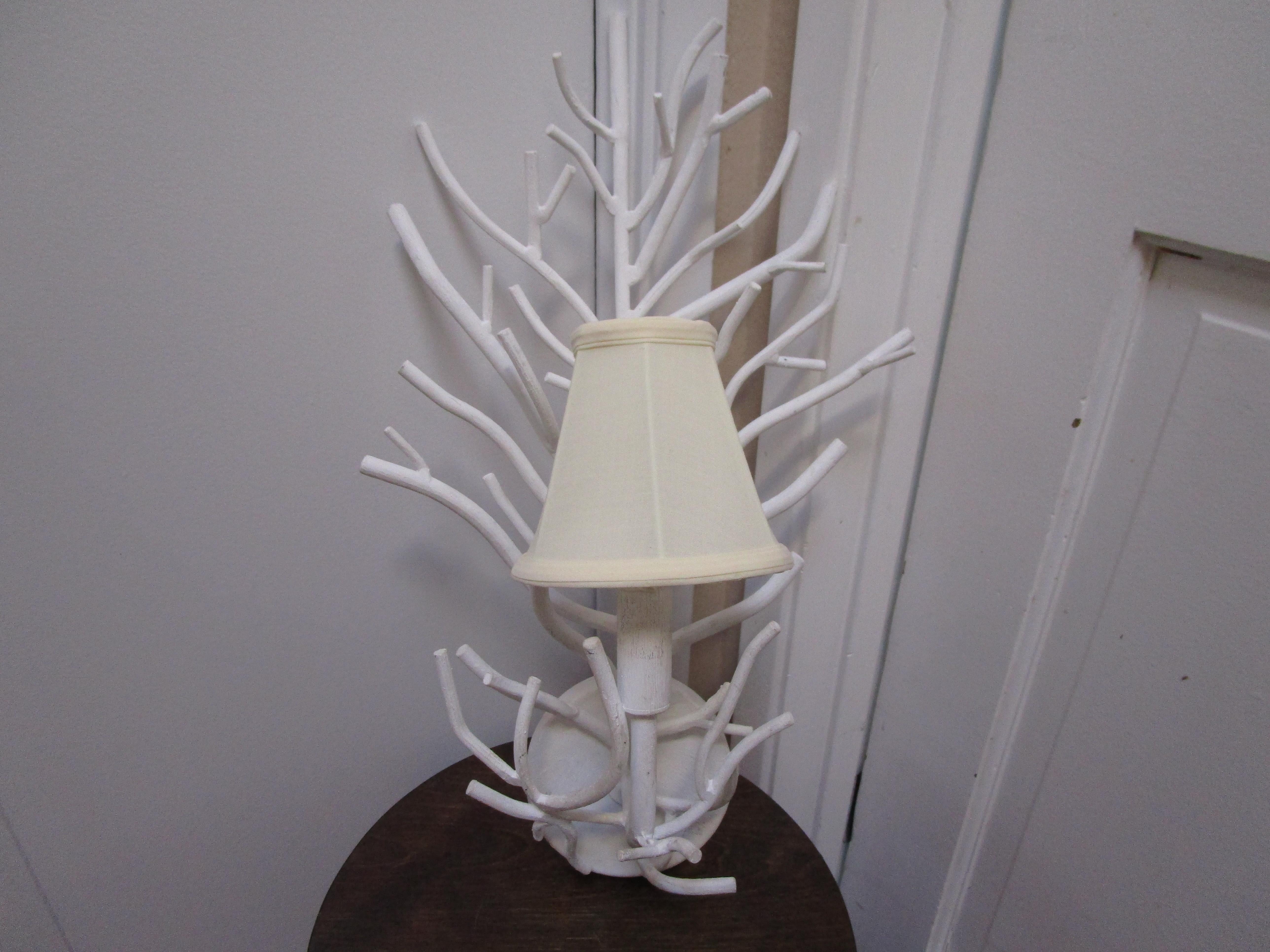 Coral effect or twig effect, the name of this beautiful sconce that we picked up at auction is not as important as the form and the statement lighting it can create. Nor is it as important as the set we have imagined for a designer in search of