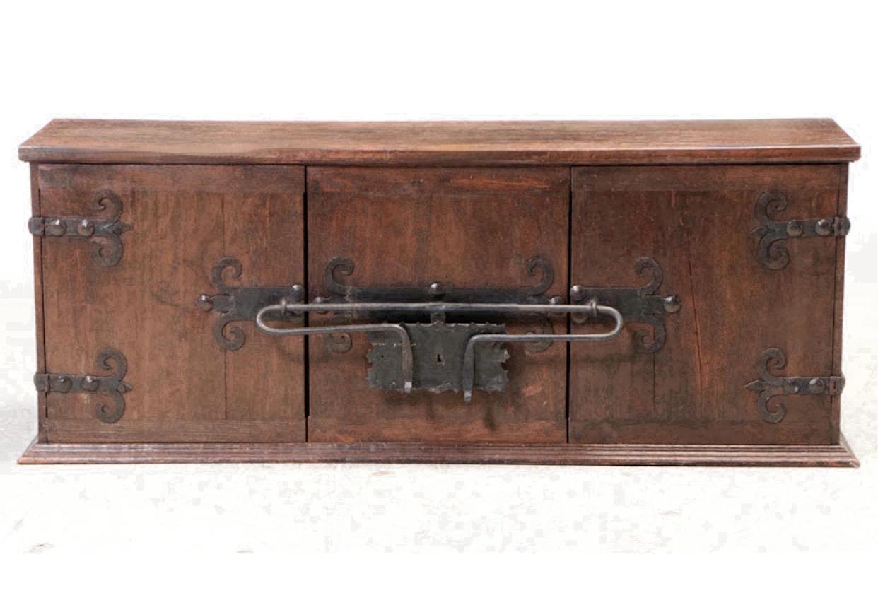 Impressive Artes de Mexico Internacionales patinated pine cabinet with heavy hinged wrought iron lock and hammered iron hinges with patina black enamel. An incredible work of art in the style of Spanish Colonial. Two door front with stationary