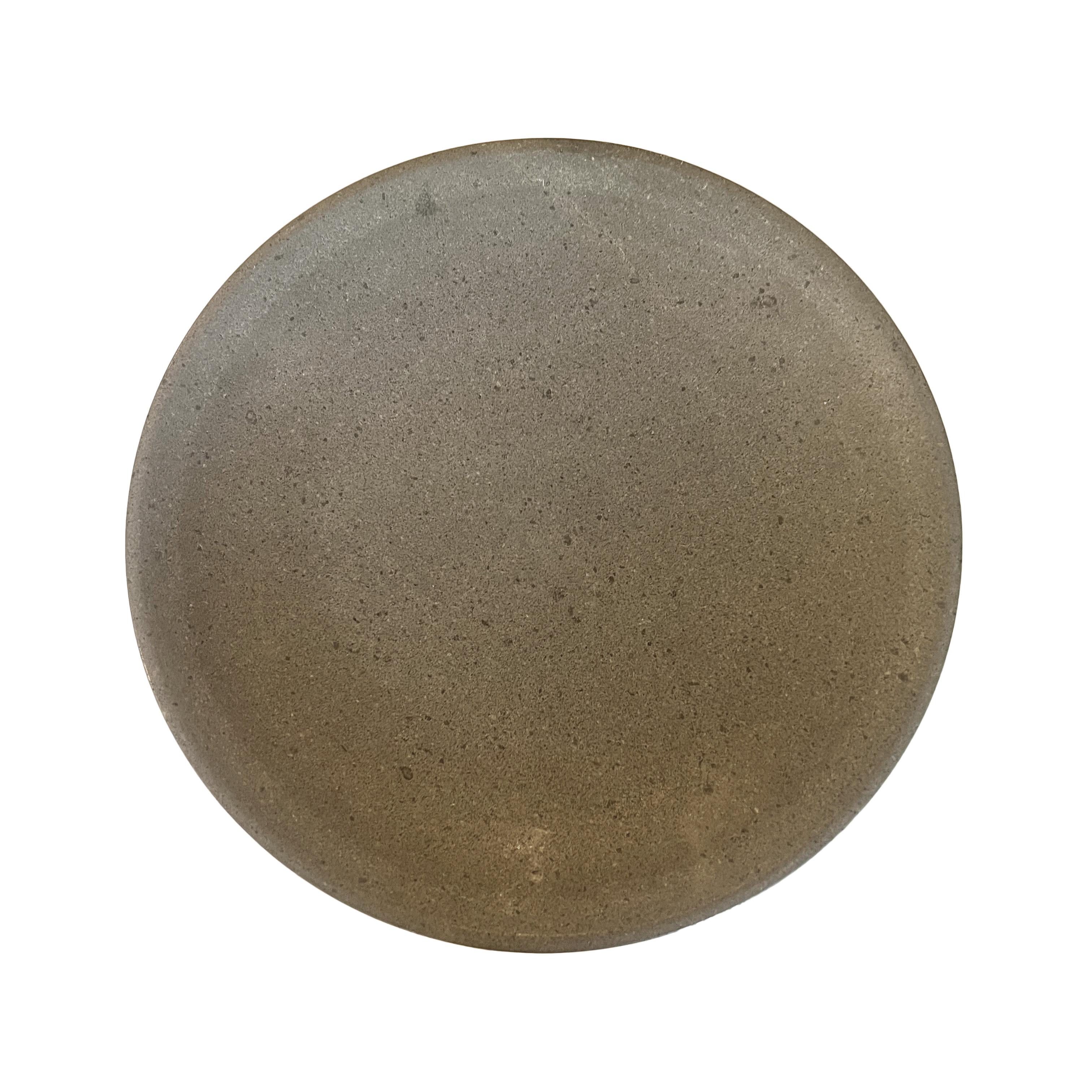 An artesian concrete bowl/plate, a masterpiece of design that marries form with function. Crafted from solid concrete, this decorative dish boasts a substantial heft, emphasizing its durability and quality craftsmanship. Its very weight speaks to