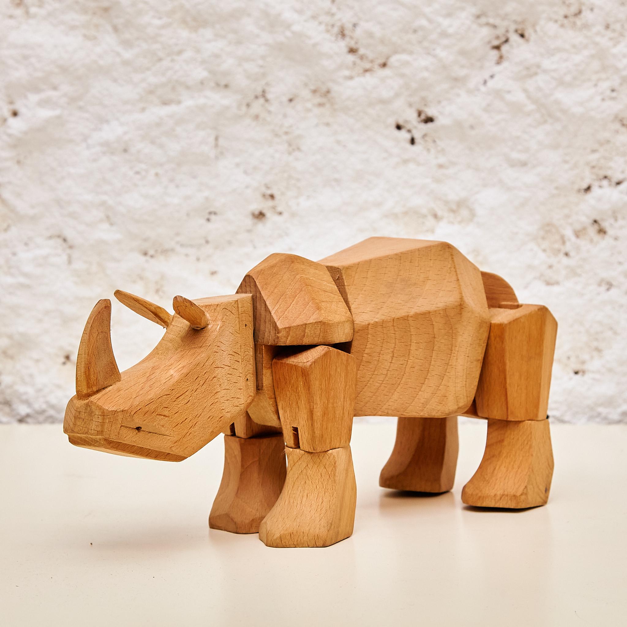 Immerse yourself in artful mastery with the solid wood rhino sculpture 