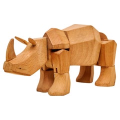 Artful Mastery: Solid Wood Rhino Sculpture 'Areaware' by David Weeks Studio
