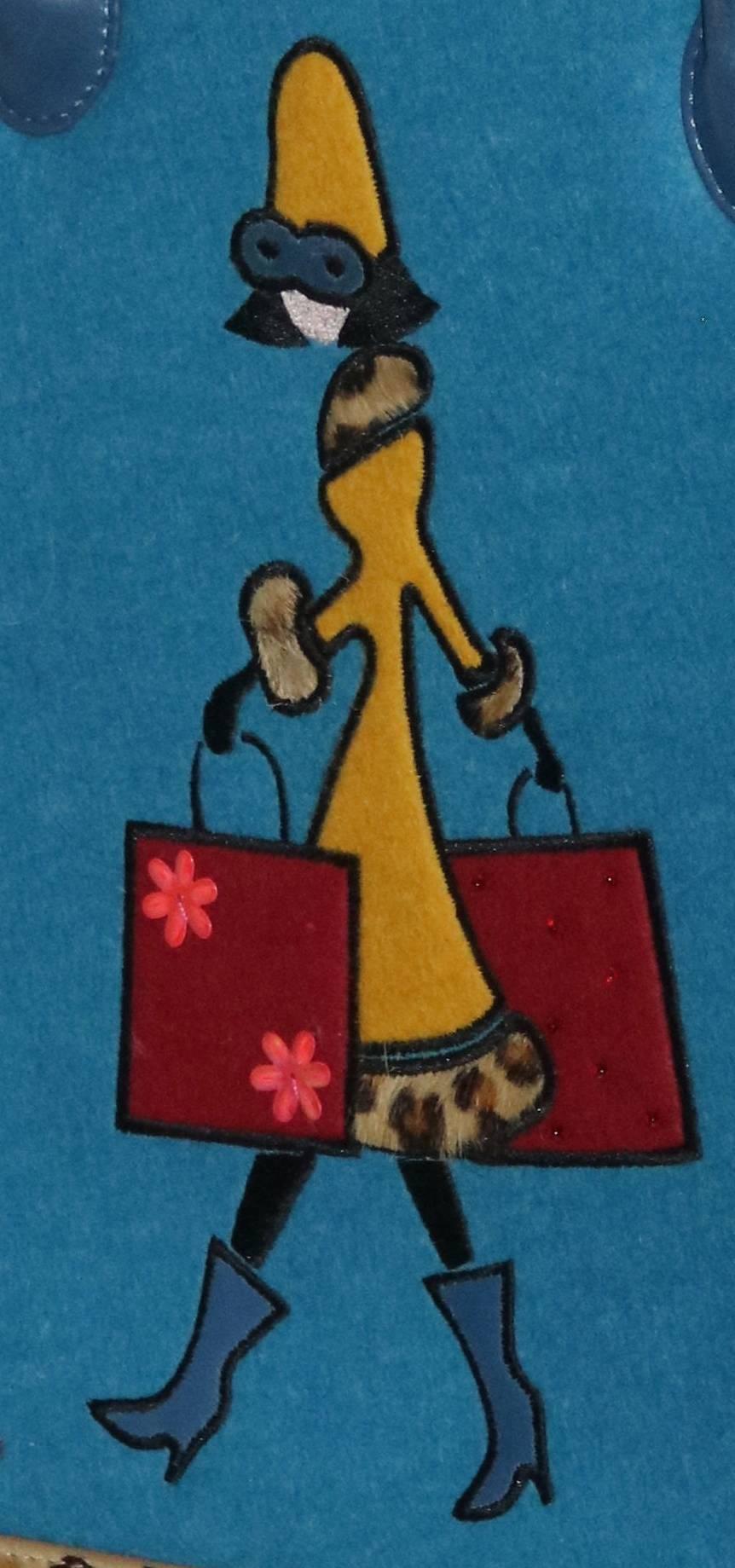 Rare vintage adorable Nicole Miller handbag of fashionista girl shopping with two shopping bags leopard trim coat, hat, sunglasses and boots-leather and leopard calf hair fur trim edges front and back--
The most design inspired embroidered