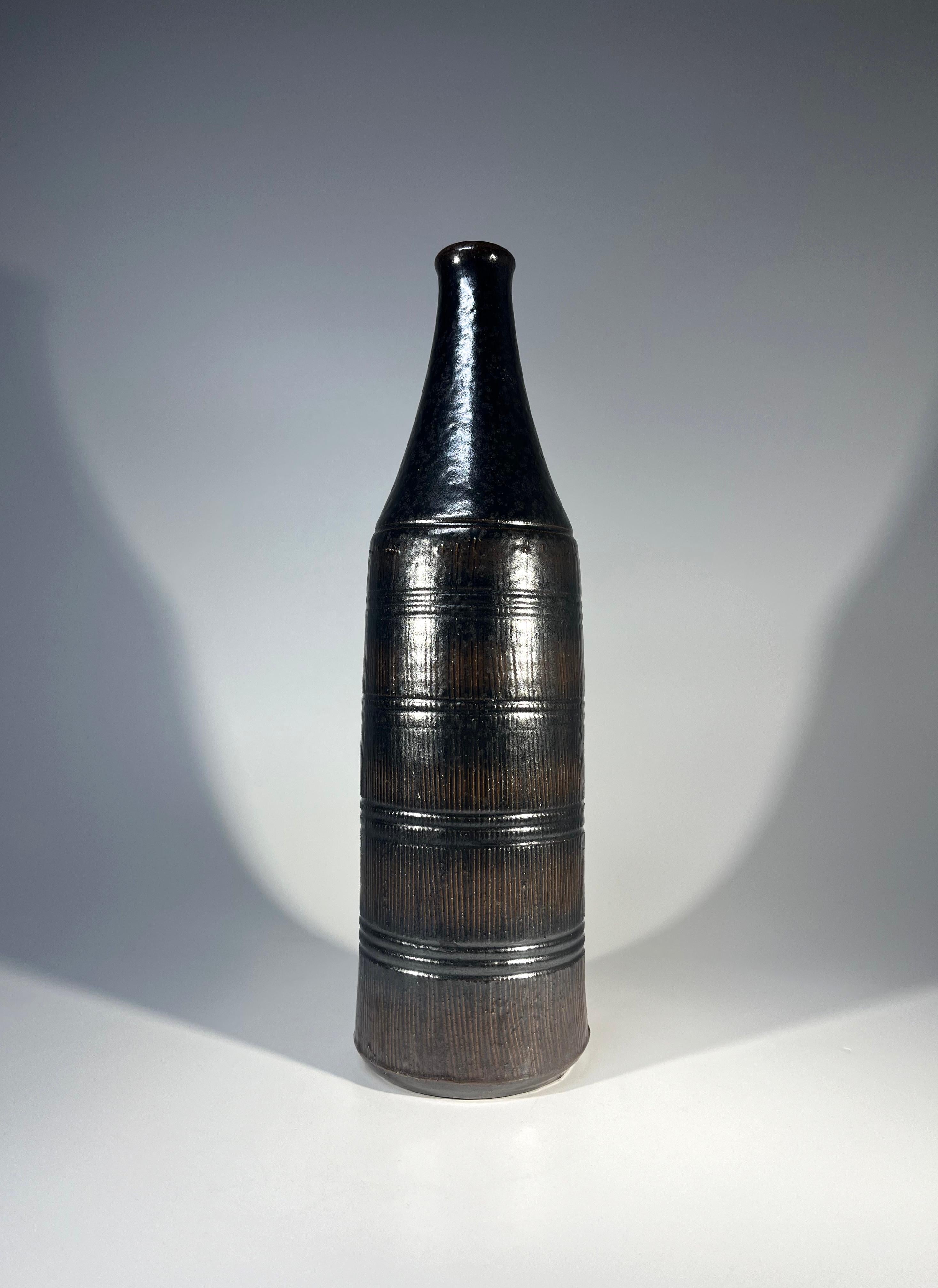 Superb stoneware bottle vase by Arthur Andersson for Wallåkra of Sweden
Tactile and appealing, with an Intense dark coffee brown and black glaze over incised decoration
Circa 1950's
Signed Wallåkra to base
Height 9.5 inch, Diameter 2.75 inch
In
