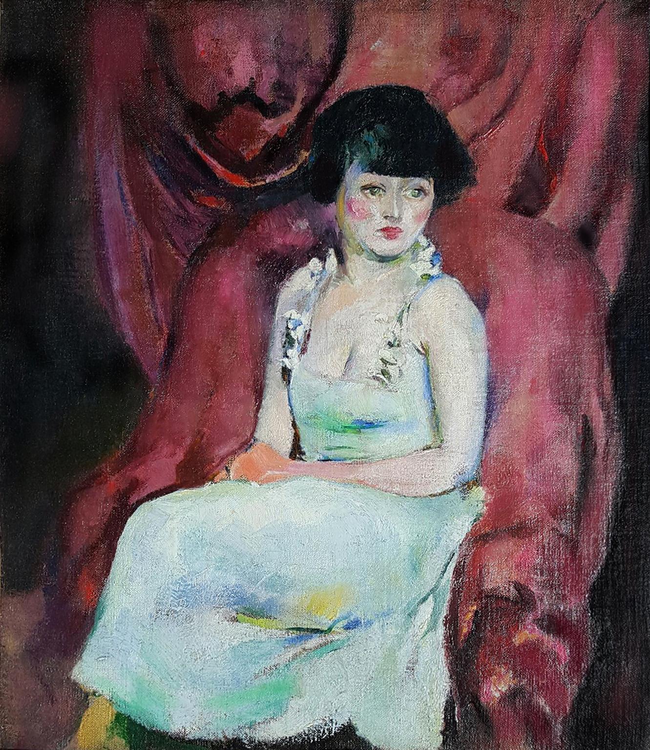Portrait of a Charming Seated Woman Against Maroon Drapes