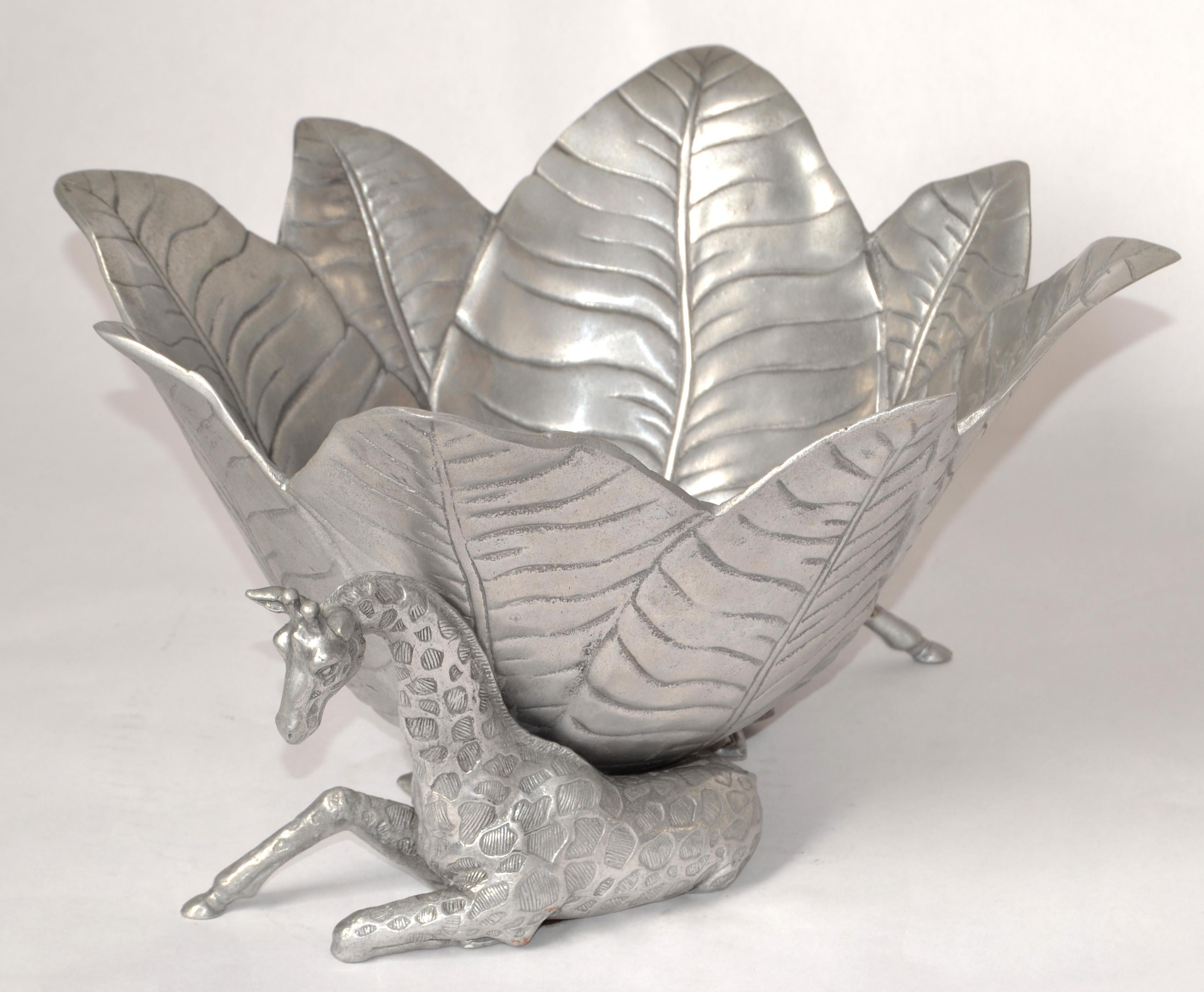 Whimsical Arthur Court Safari Themed Ice Bucket or Wine Cooler for Champagne Lovers.
Made out of Sandblast Aluminum and decorated with two resting Giraffe's.
The Safari Collection by Arthur Court was made in 2004 and is a great addition to Your Bar