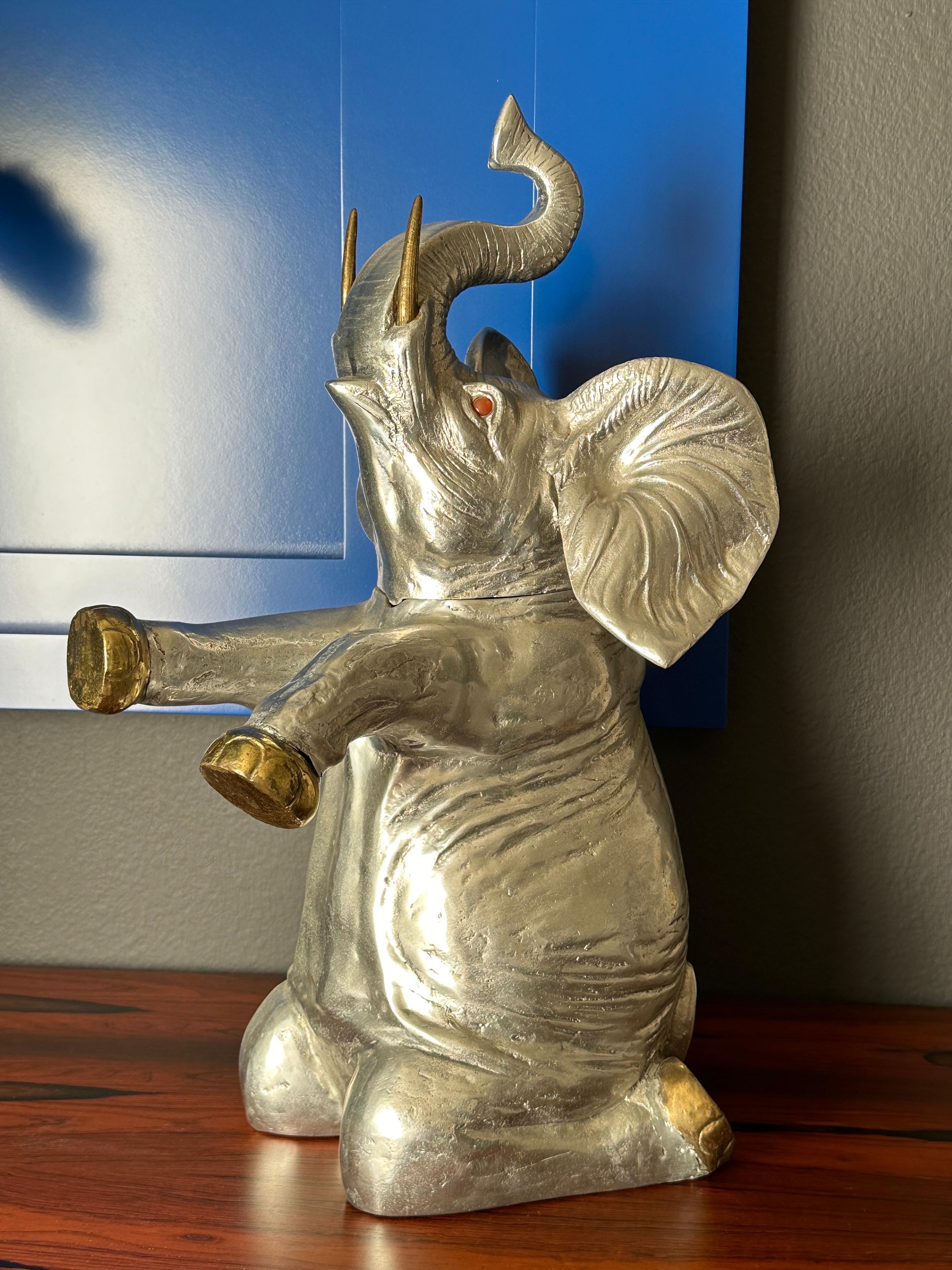 Arthur Court cast aluminum elephant shaped wine /  beverage cooler with brass feet and tusks.
It is 12 high in open position.