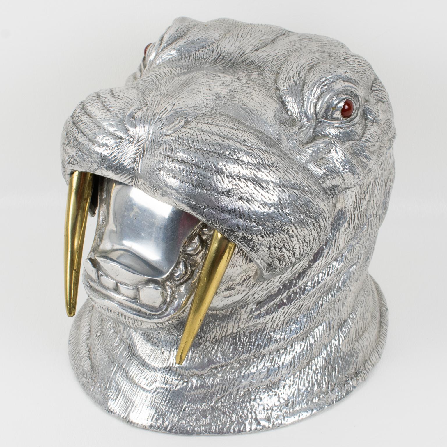 Outstanding Arthur Court (1928 - 2015) signed aluminum walrus. A fun bar accessory, wine, or champagne cooler that can be used also as an ice bucket. In the shape of a walrus with an articulated head, brass tusks, and carnelian stone eyes.
The head