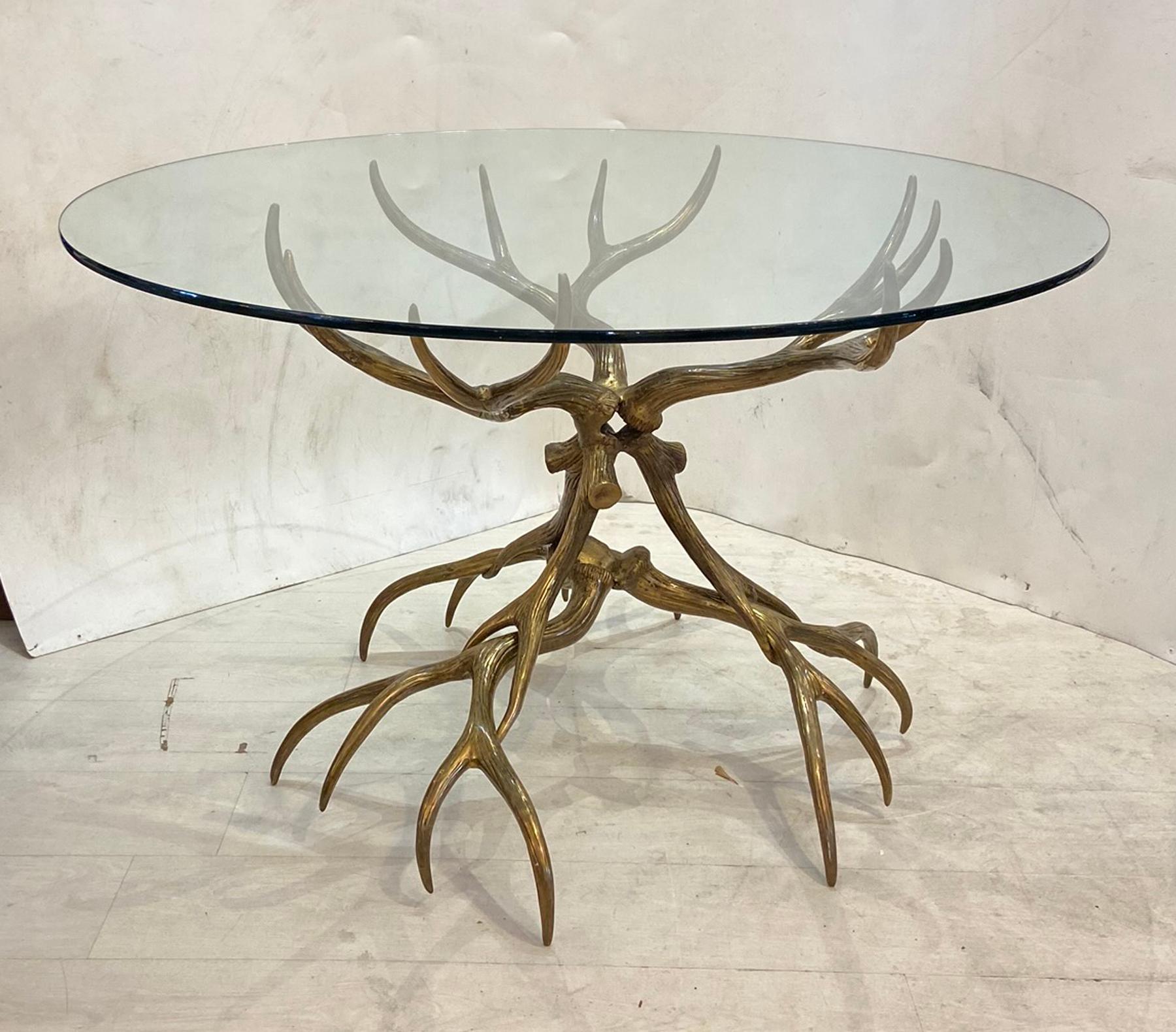 Vintage antler cast aluminum table with bronze finish and round glass top. Design and made by Arthur Court Good clean finish table could be used as a center table or a dinette table.