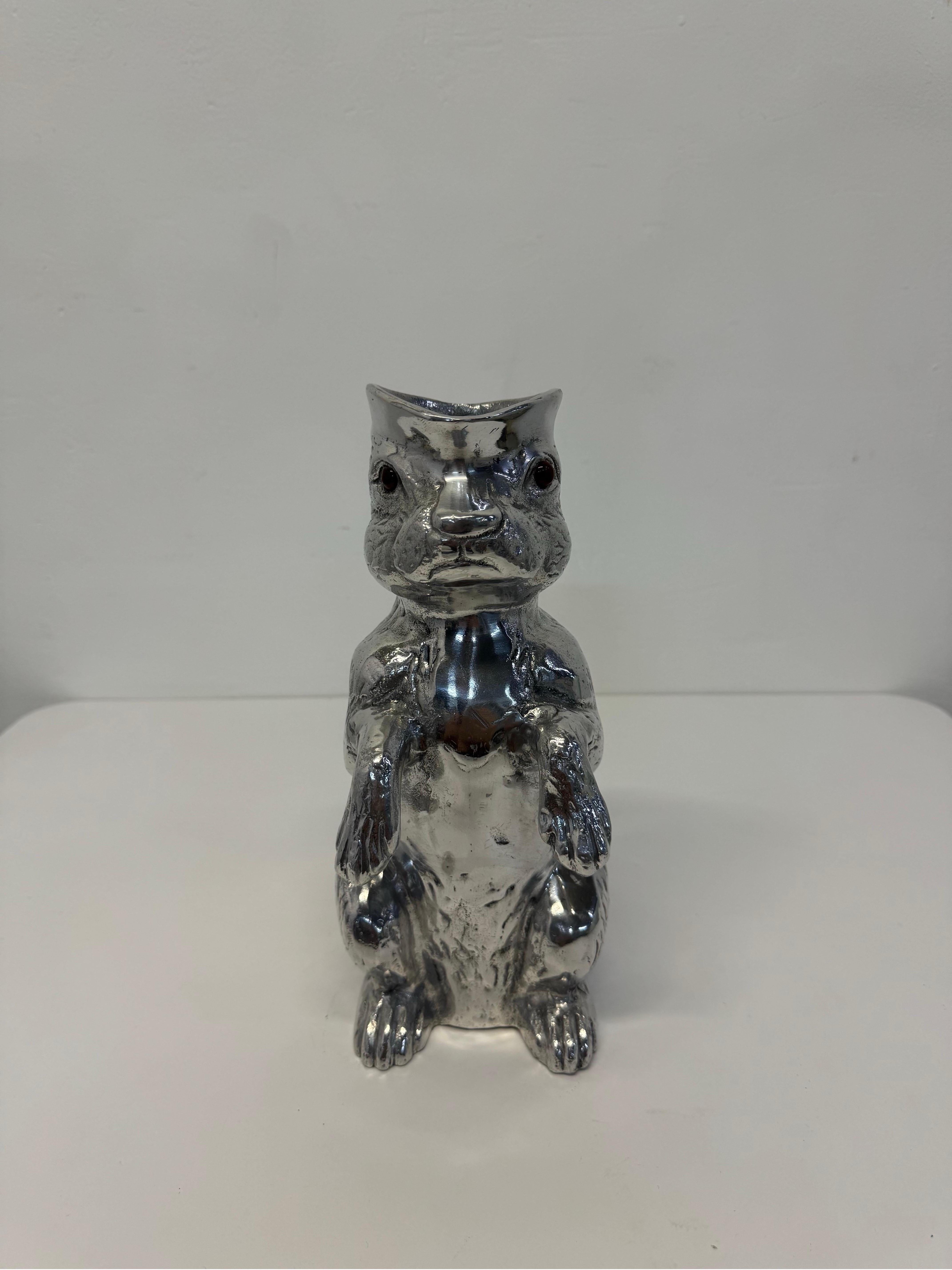 20th Century Arthur Court aluminum pitcher in the form of a bunny rabbit with red glass eyes standing on its hind legs.  Signed and dated.