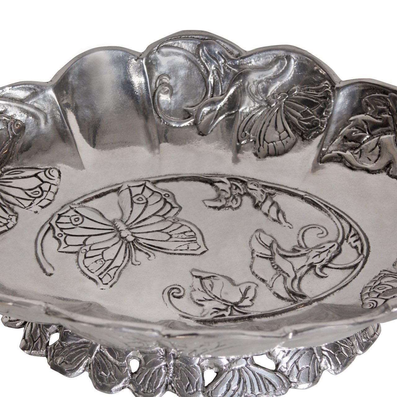 Arthur Court plated aluminum centerpiece serving bowl with butterfly decoration.

Dimensions: 
16”L x 9”W x 6”H