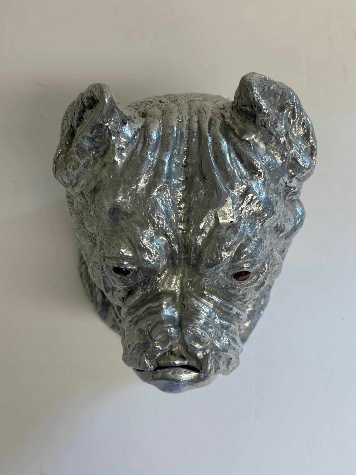 Cast aluminum ice bucket by Arthur Court in the form of a bulldog's head wearing a wide collar. The lid lifts off for easy access and is finished with glass eyes.  Imprint Arthur Court on bottom.