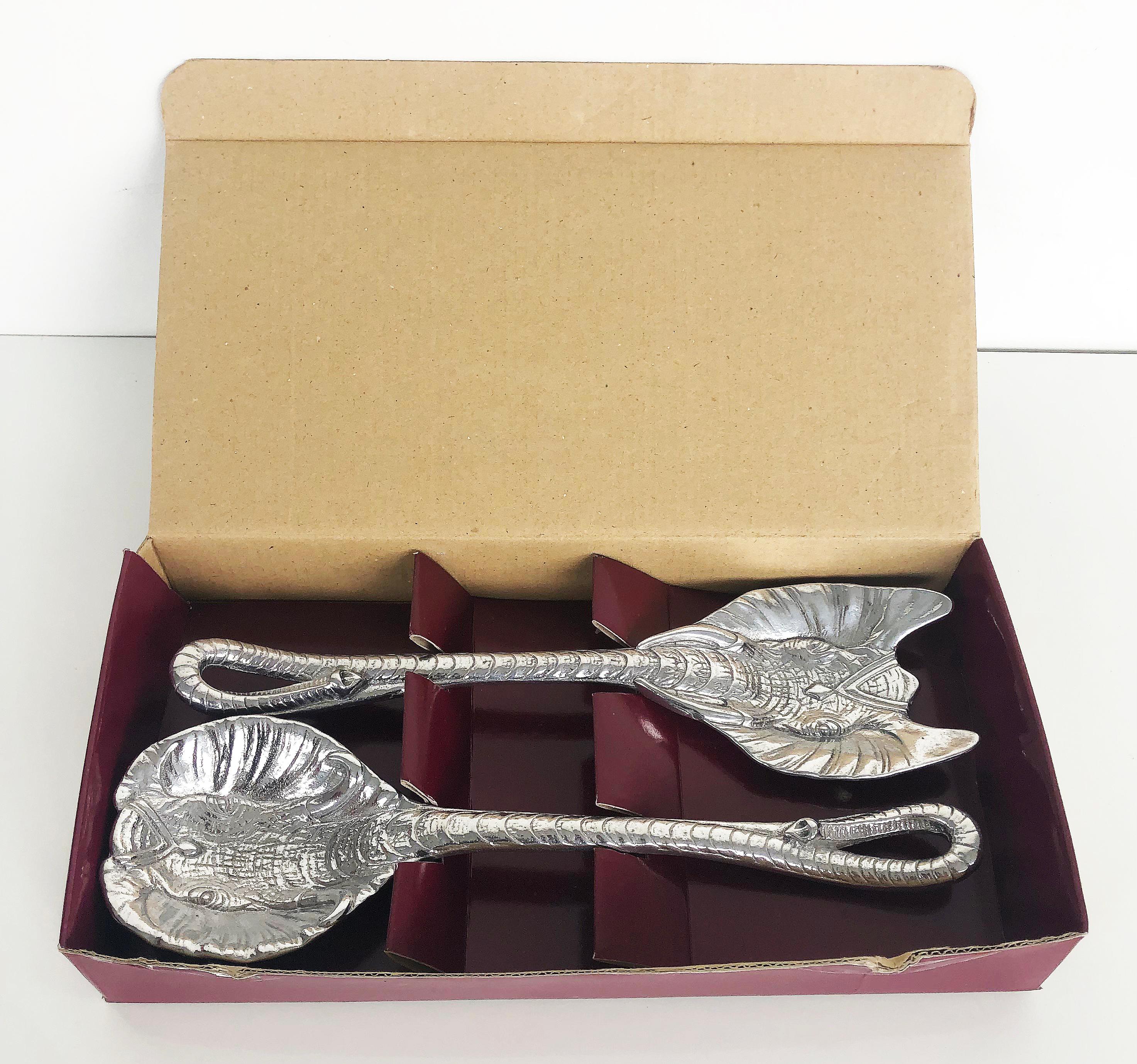 Arthur Court designs aluminum elephant salad servers, new in box

Offered is a vintage yet unused set of Arthur Court aluminum Elephant salad servers including a fork and spoon. The set includes the original box.
