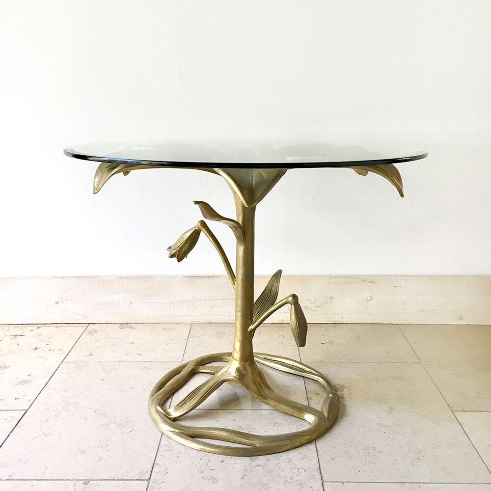 Arthur Court designed gilded aluminium lily centre table with circular glass top 1960s, California USA. 

Arthur Court's (1928-2015) aluminium furniture which came about in the 1960s due to new casting processes and depicted natural forms such as