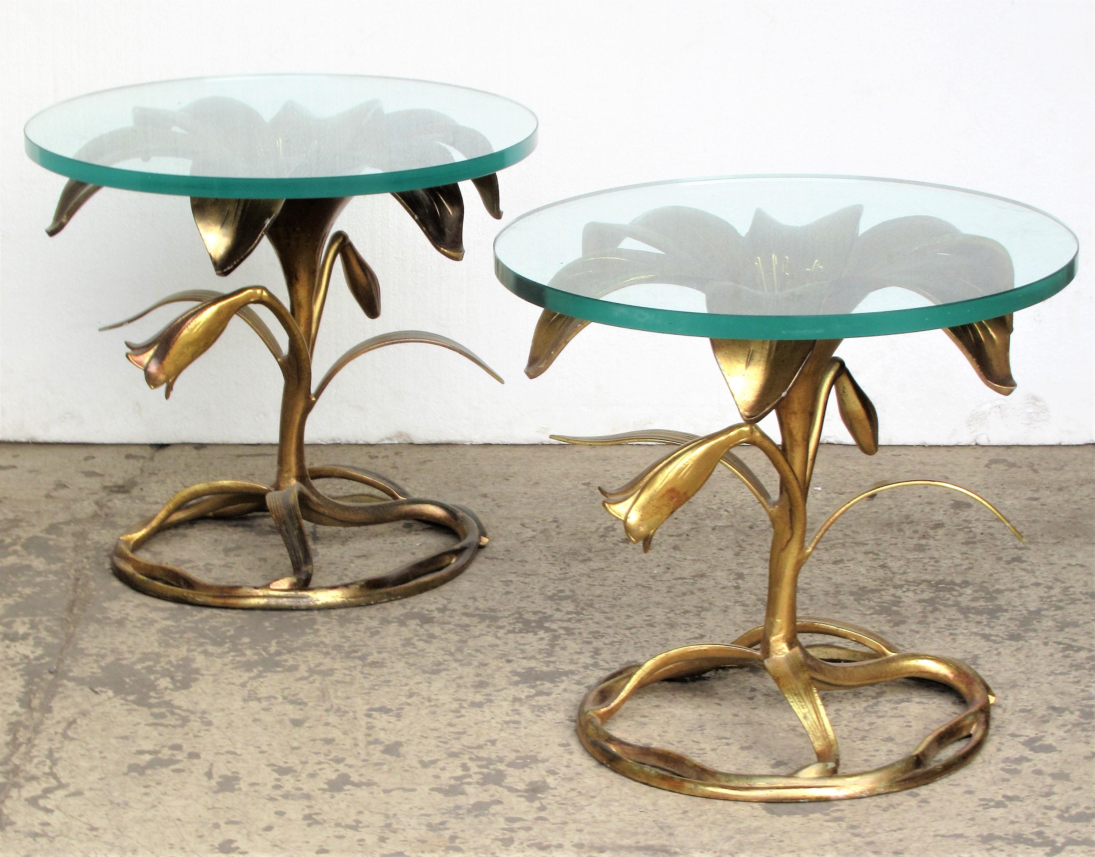 Pair of Arthur Court gilded aluminum lily side tables with the original half inch thick circular beveled glass tops, circa 1970. Look at all pictures and read condition report in comment section.