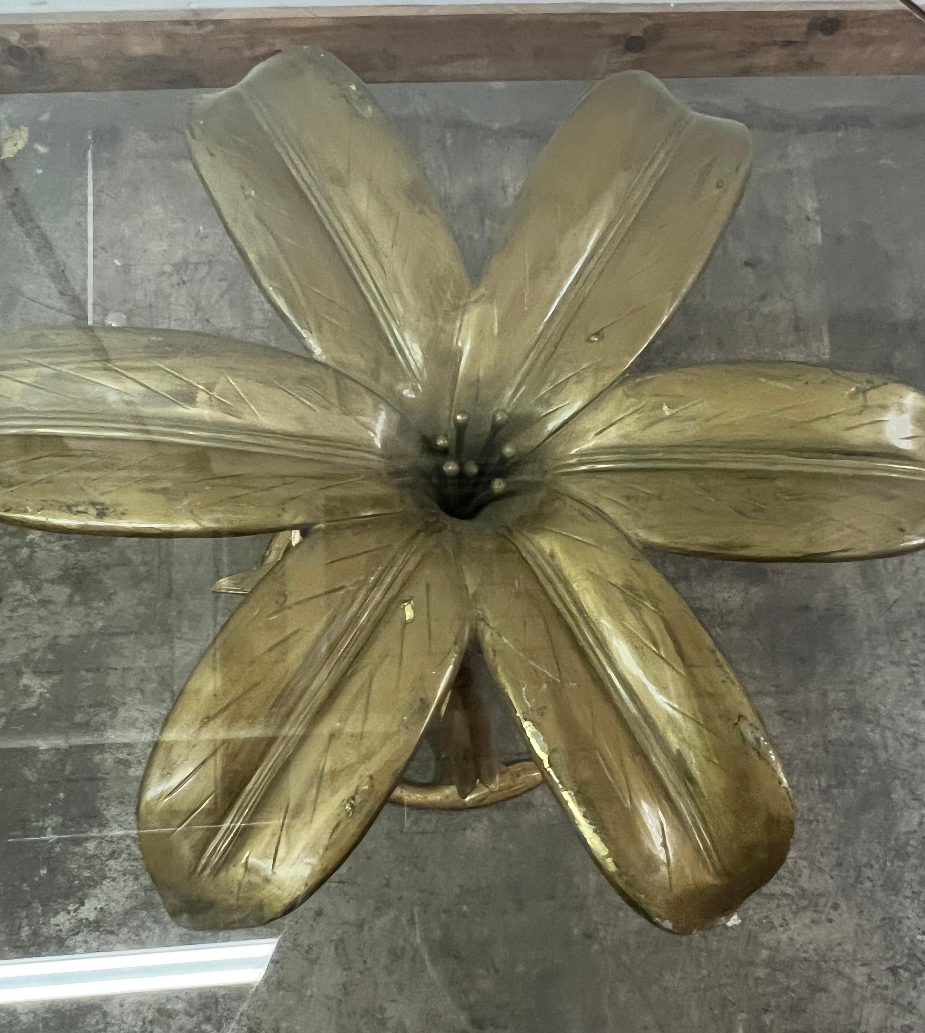 A Sculpted Lily, which has become one of Arthur Court's Signature pieces.  This version is best used as a dining or side table.  The Glass shown is 48