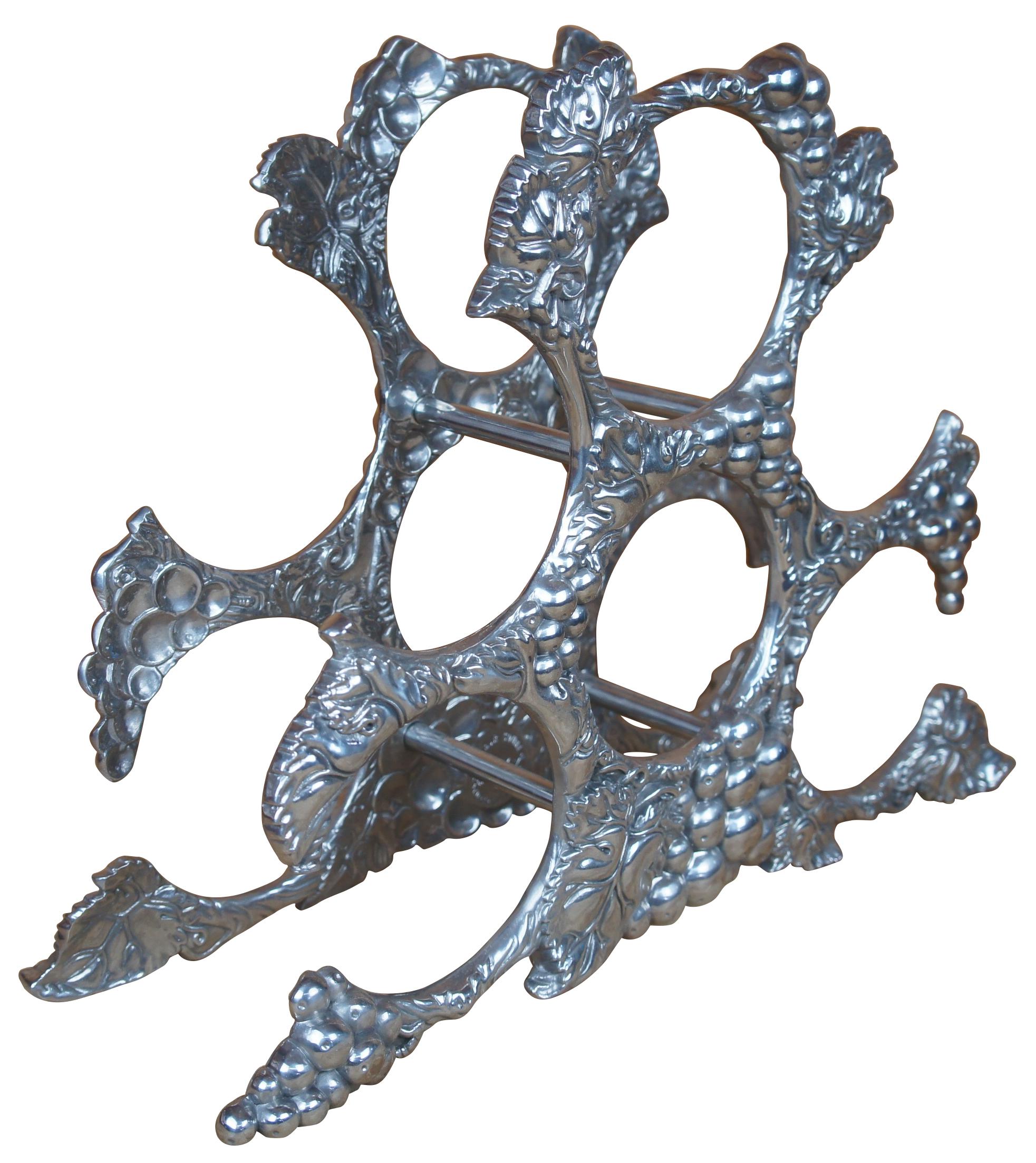 Cast aluminum six (6) bottle wine rack holder decorated with classic grape leaves design by Arthur Court. Measure: 15