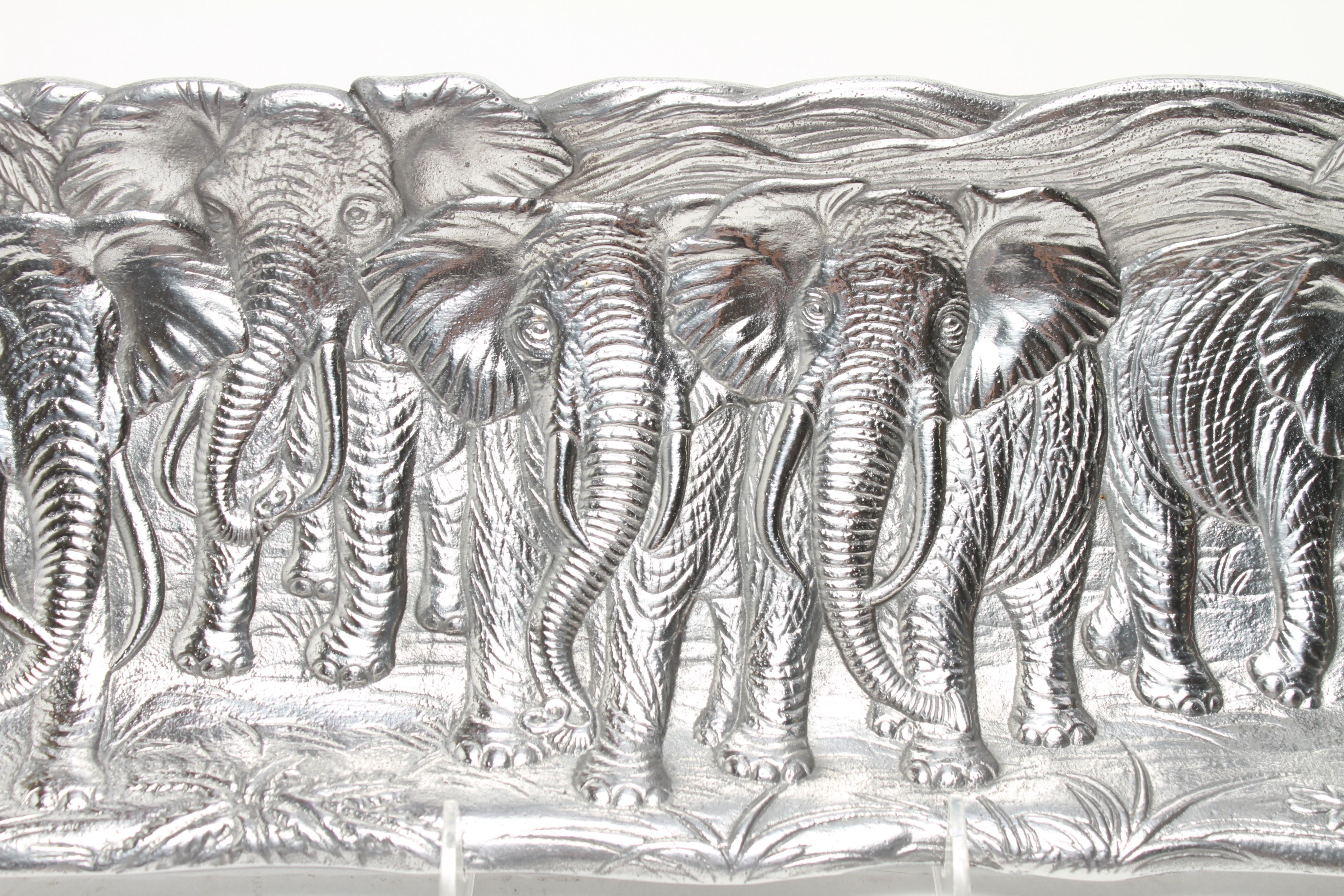 Arthur Court Postmodern elephant aluminum serving tray in oblong shape, with incised decoration of various elephants. The piece has a maker's mark and is dated 1986 underneath. In great vintage condition with age-appropriate wear.