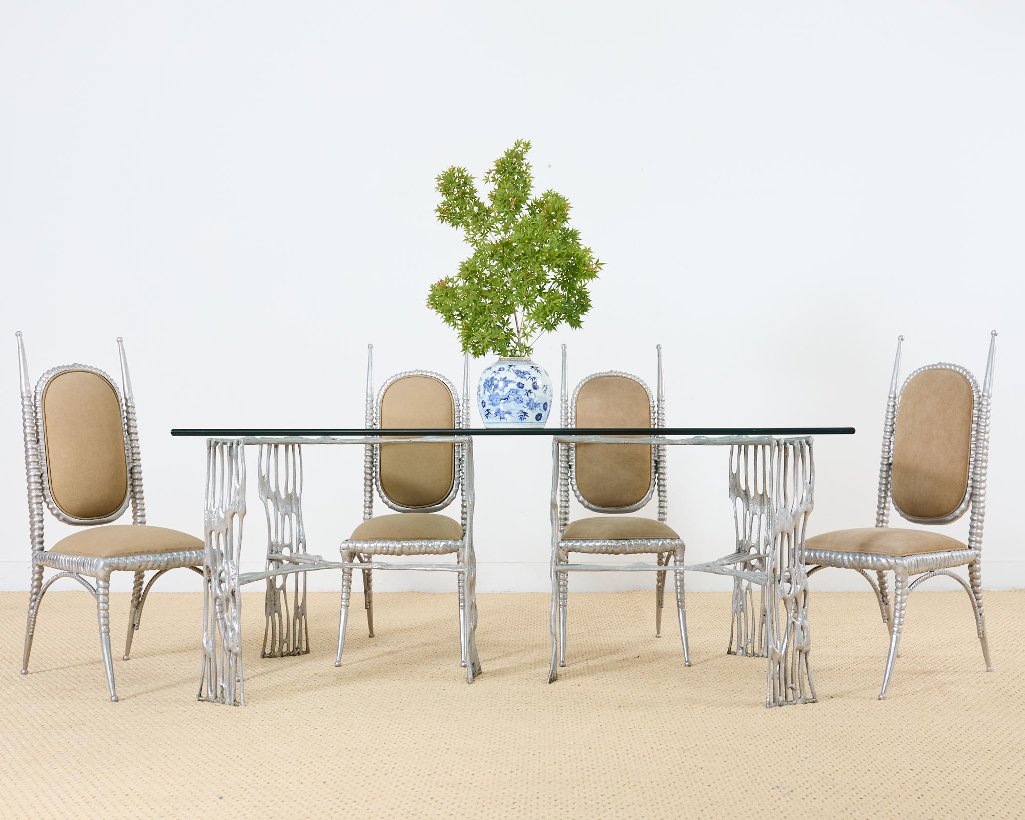 Dramatic post-modern style double pedestal dining table designed by Arthur Court. The Saguaro table features a sculptural aluminum frame construction having three conjoined legs. Each pedestal base measures 33 inches across topped with a thick pane