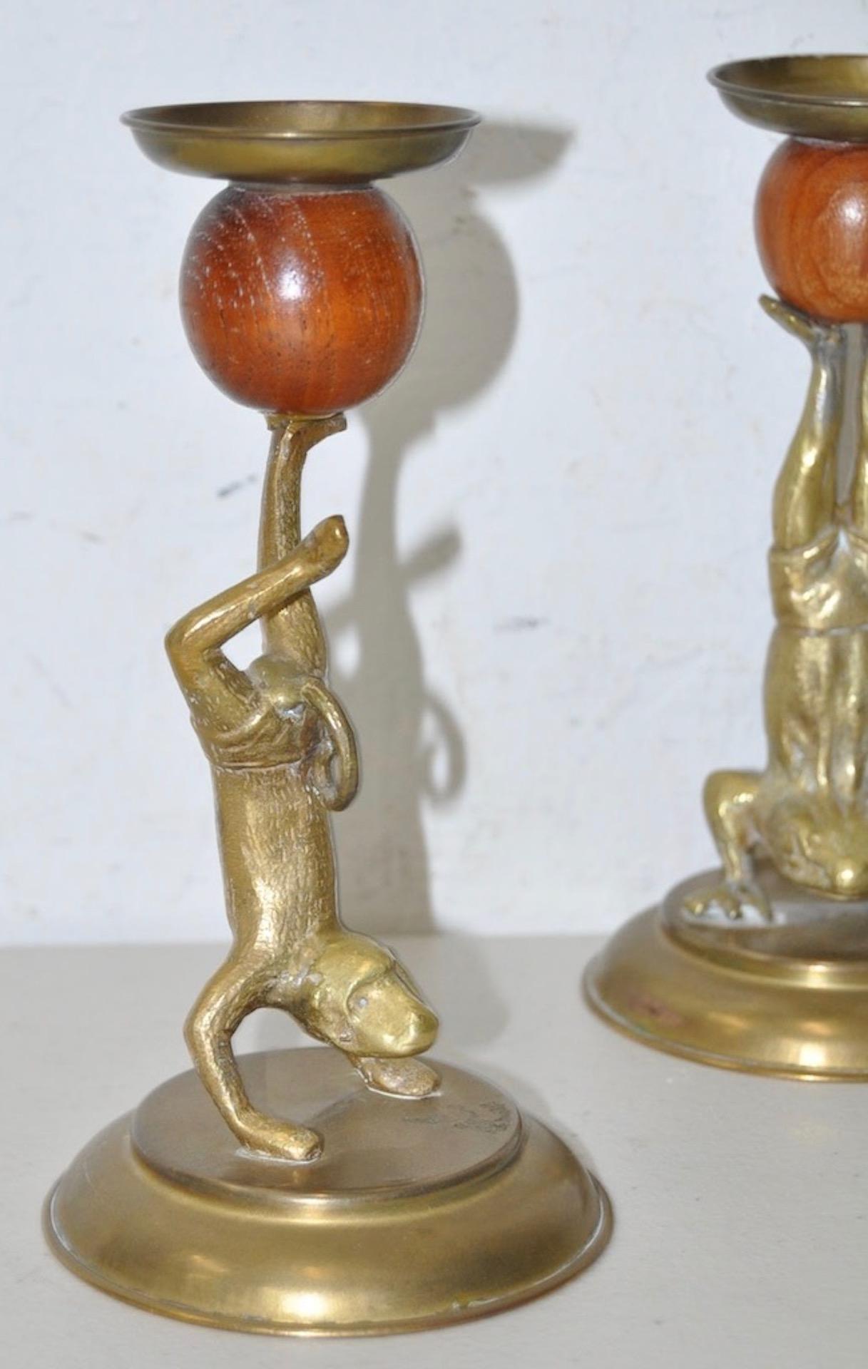 Arthur Court vintage brass and teak candlesticks, circa 1978

Pair of playful acrobatic frog candlesticks.

Dimensions 3 3/4