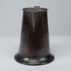 Arthur Dixon for the BGH. An Arts & Crafts hand-hammered copper jug