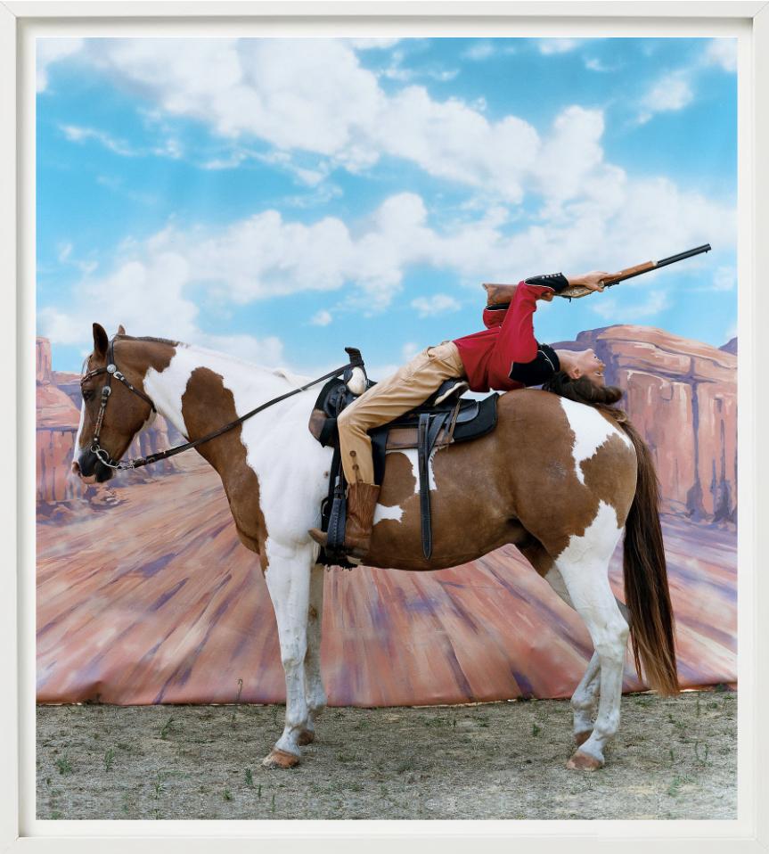 Annie get your Gun - Carmen Kass on a Hors for Vogue, Fine Art Photography, 2002 - Gray Color Photograph by Arthur Elgort