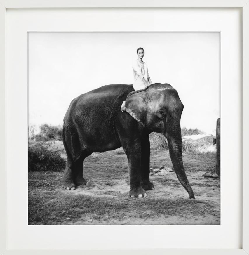 Kate Moss in Nepal, British Vogue - Model on elephant, fine art photography 1993 - Contemporary Photograph by Arthur Elgort