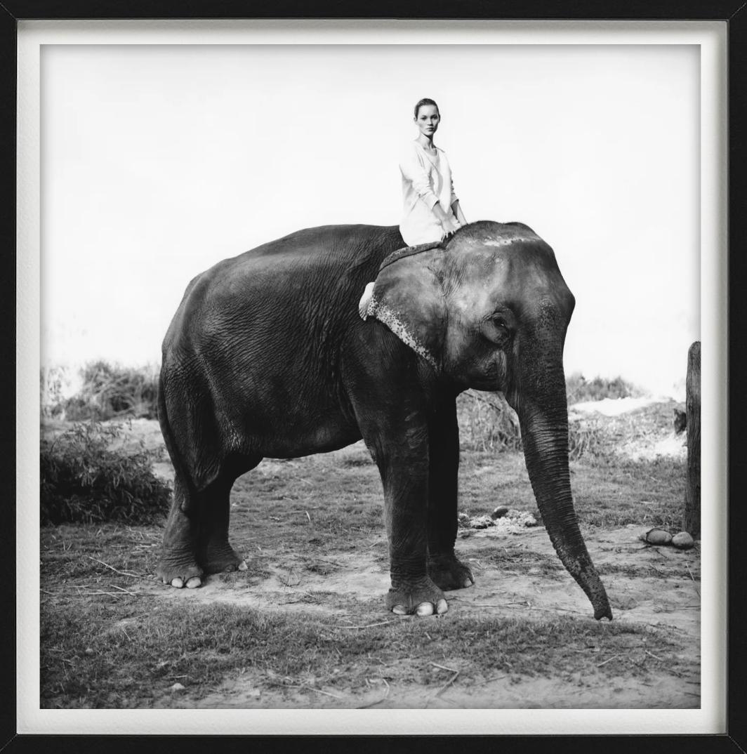 Kate Moss in Nepal, British Vogue - Model on elephant, fine art photography 1993 - Gray Black and White Photograph by Arthur Elgort