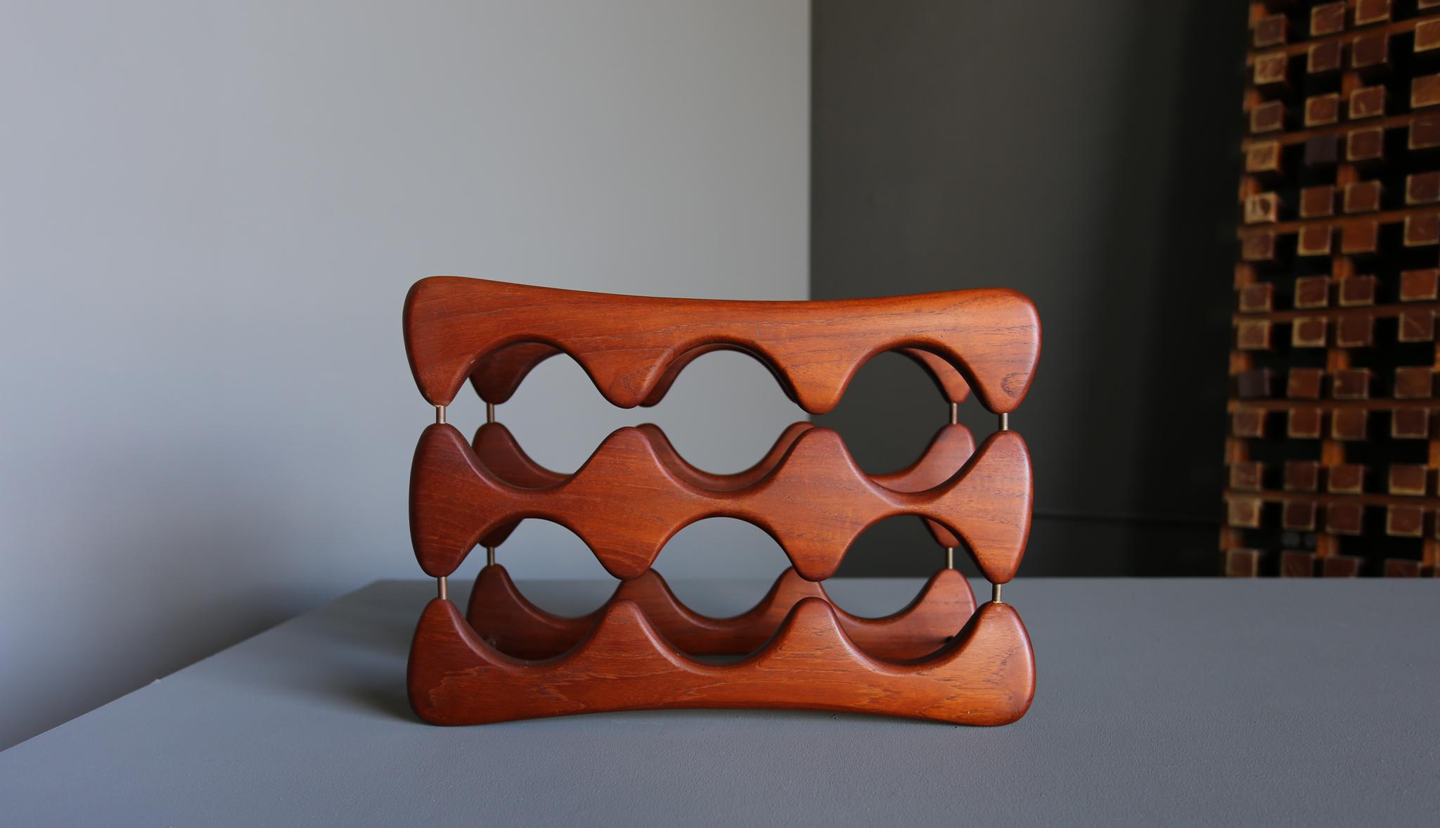 Arthur Espenet Carpenter carved walnut & brass wine rack. circa 1967.