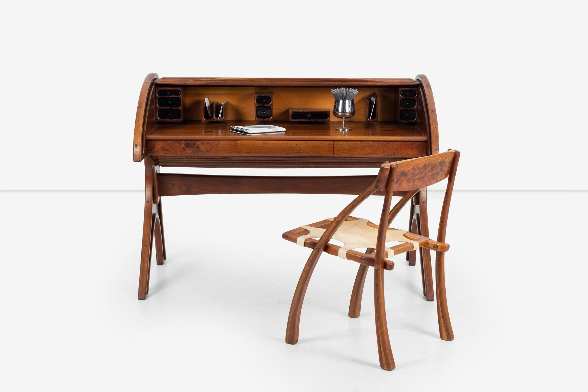 Arthur Espenet Carpenter Roll-Top Desk 1979, in American black walnut. Features:Inlay rosewood butterflies.
Three pencil drawers lined in felt. Multiple drawer and puzzle storage boxes, most felt lined, letter holders.
Under height: 26