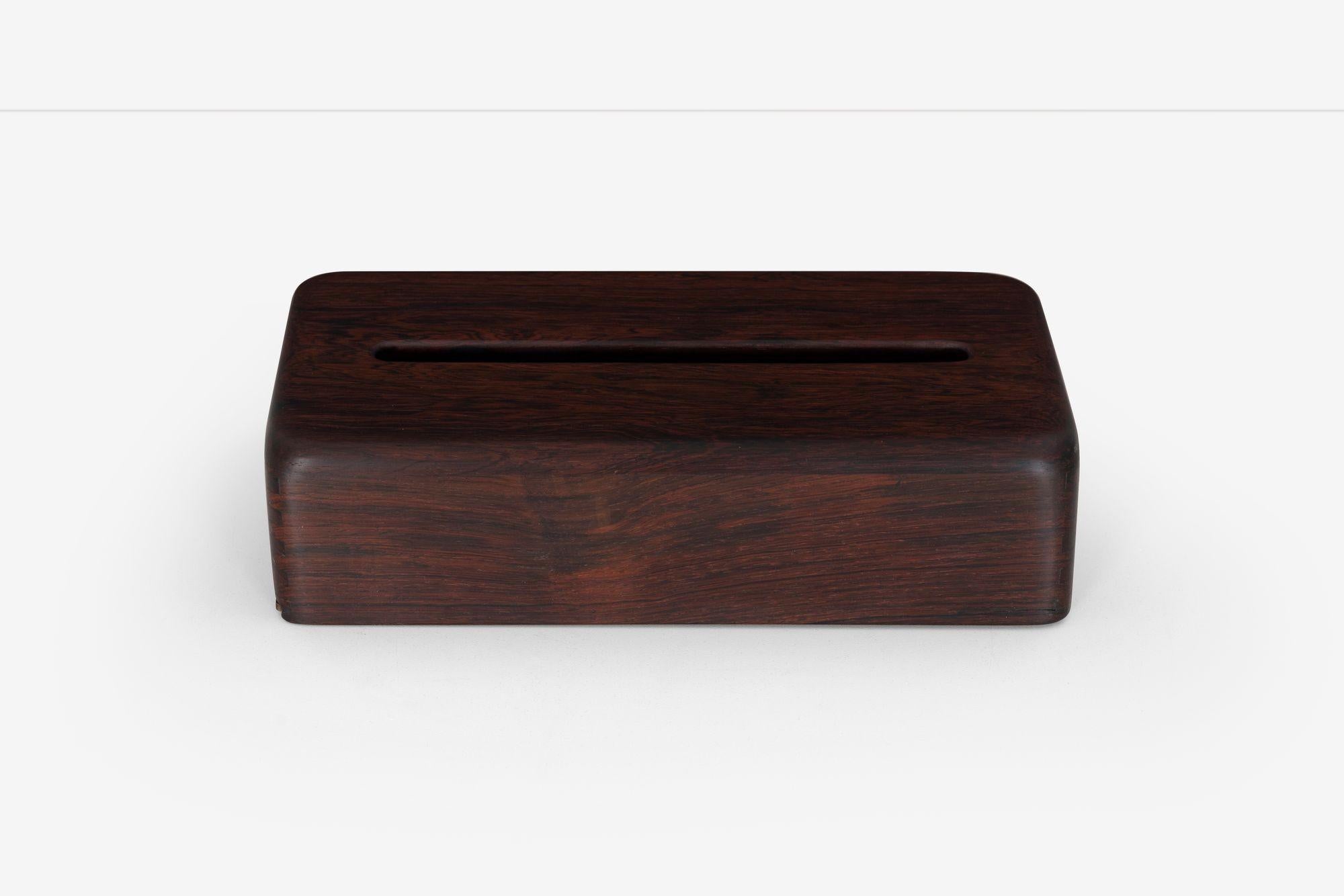 Arthur Espenet Carpenter Rosewood Tissue Box (circa 1965)
This elegant rectangular tissue box exemplifies Arthur Espenet Carpenter’s mid-century modern vision. Carpenter was a self-taught master woodworker whose celebrated furniture is held in