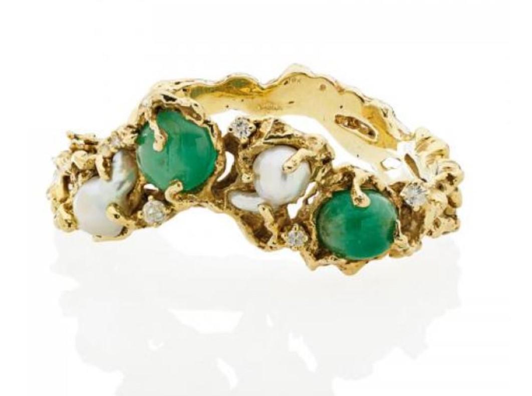 A wonderfully organic 1970's 18k yellow gold, cabochon emerald, south sea baroque pearl, and diamond hinged bangle bracelet by the famed American jeweler, Arthur King (1921 - 1991). Fits up to a 7