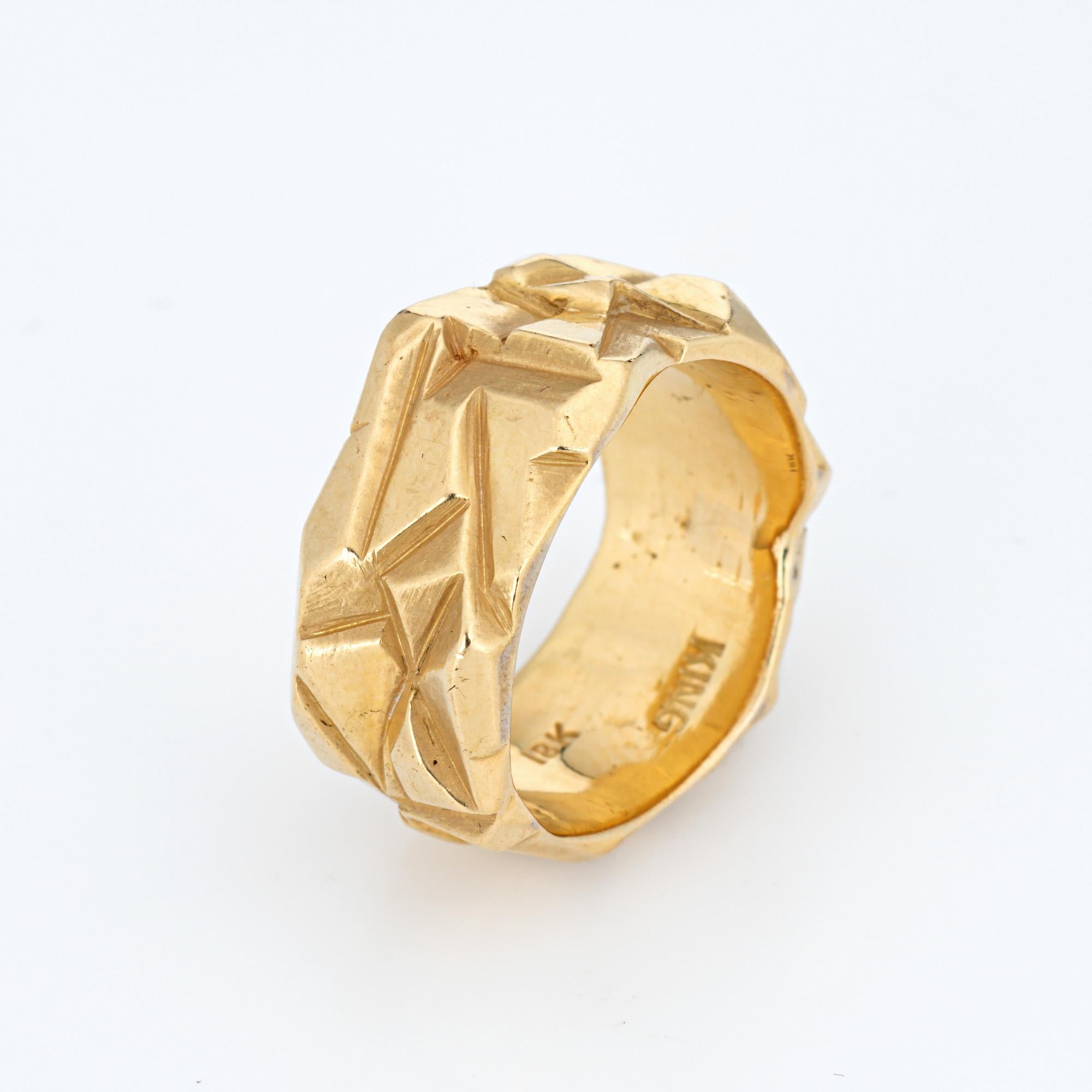 Vintage Arthur King ring crafted in 18 karat yellow gold (circa 1970s).  

Crafted by artist and goldsmith Arthur King, the ring is made in the lost wax method with geometric patterns in random form around the entire band. The ring is great worn
