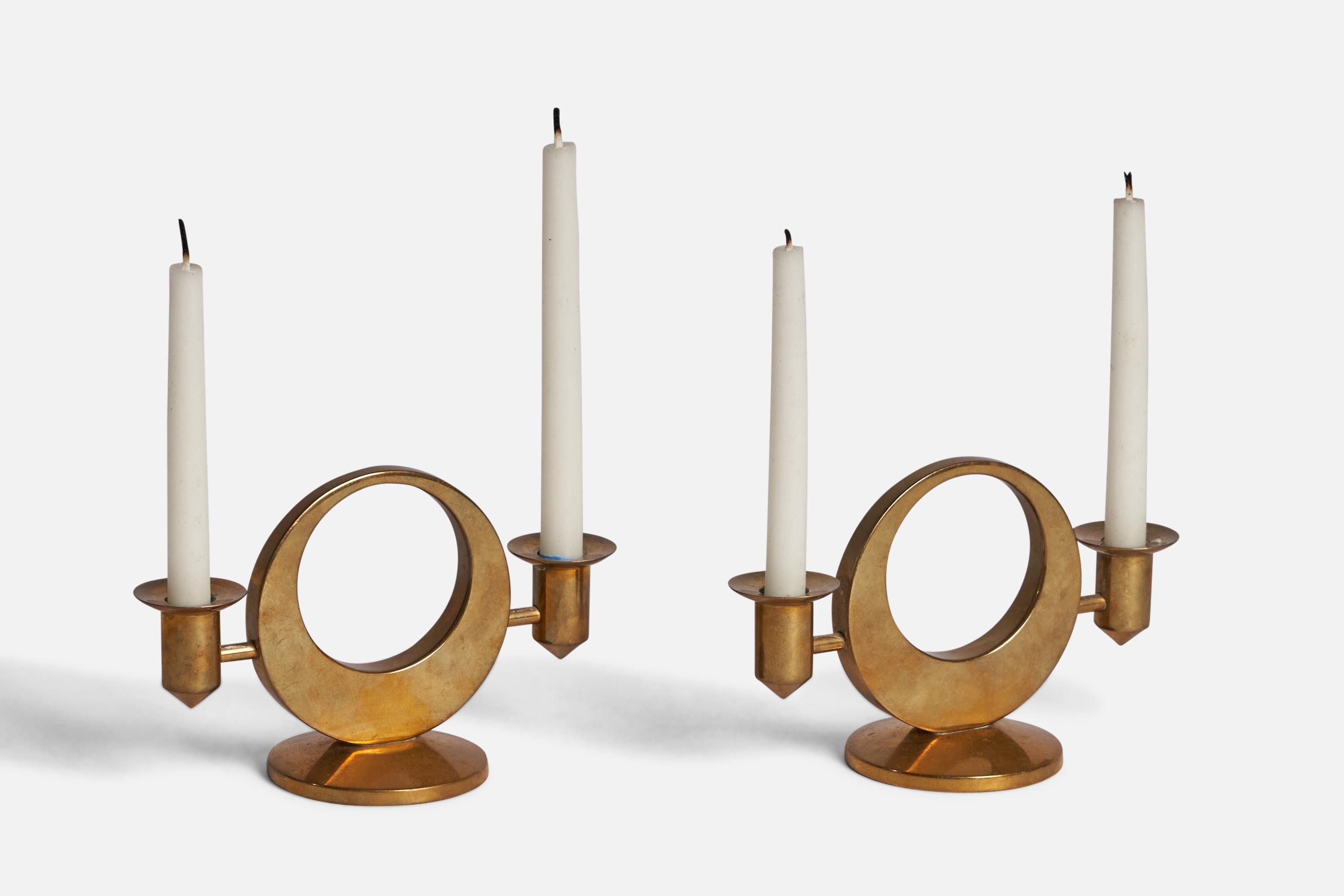 A pair of candle holders or candlesticks designed and produced by Arthur PE Kolbäck, Sweden, c. 1940s.

“Arthur Pe KOLBACK” engraving on bottom
Fits 0.5” diameter candles