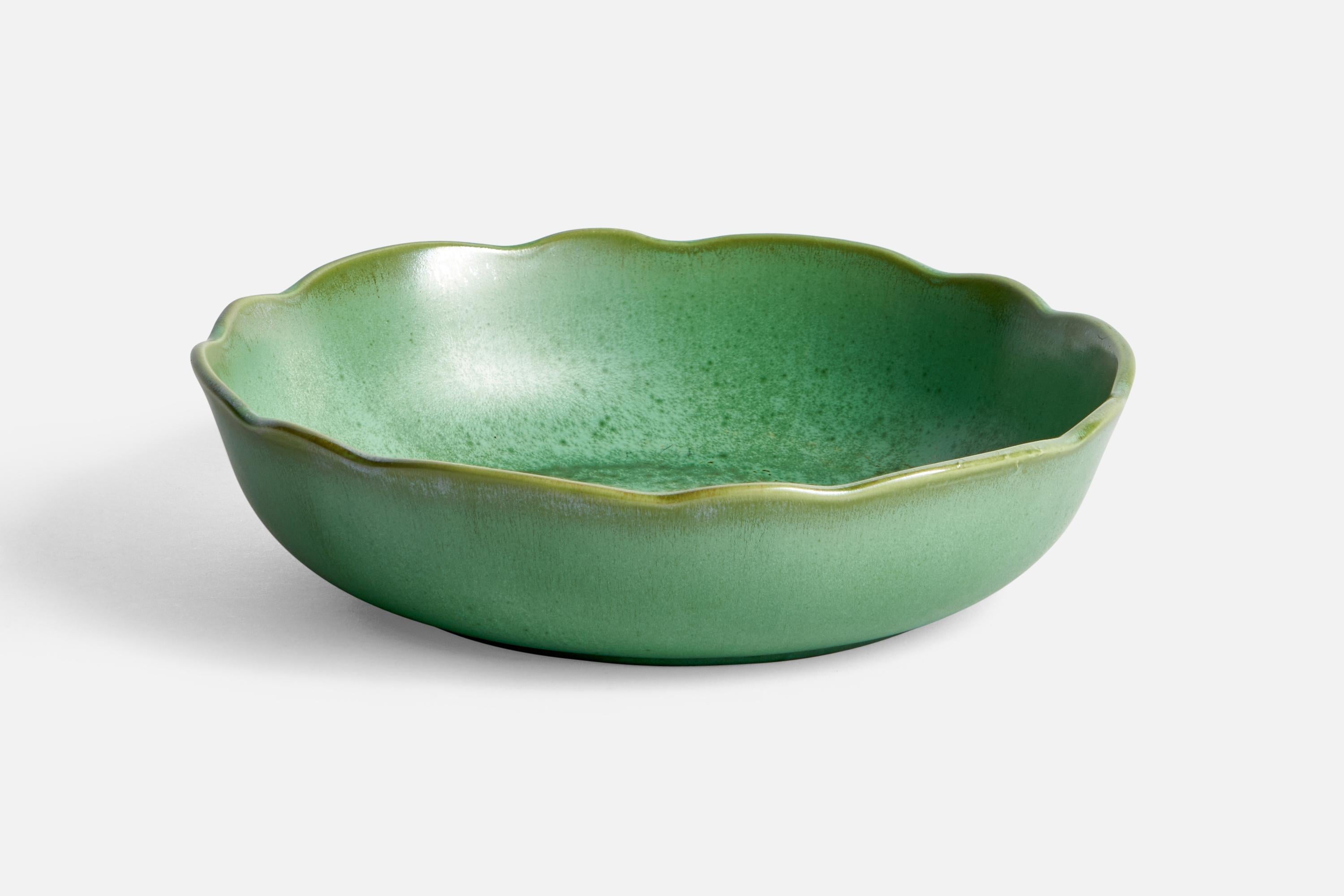 A green-glazed ceramic bowl designed by Arthur Percy and produced by Gefle, Sweden, c. 1930s.
