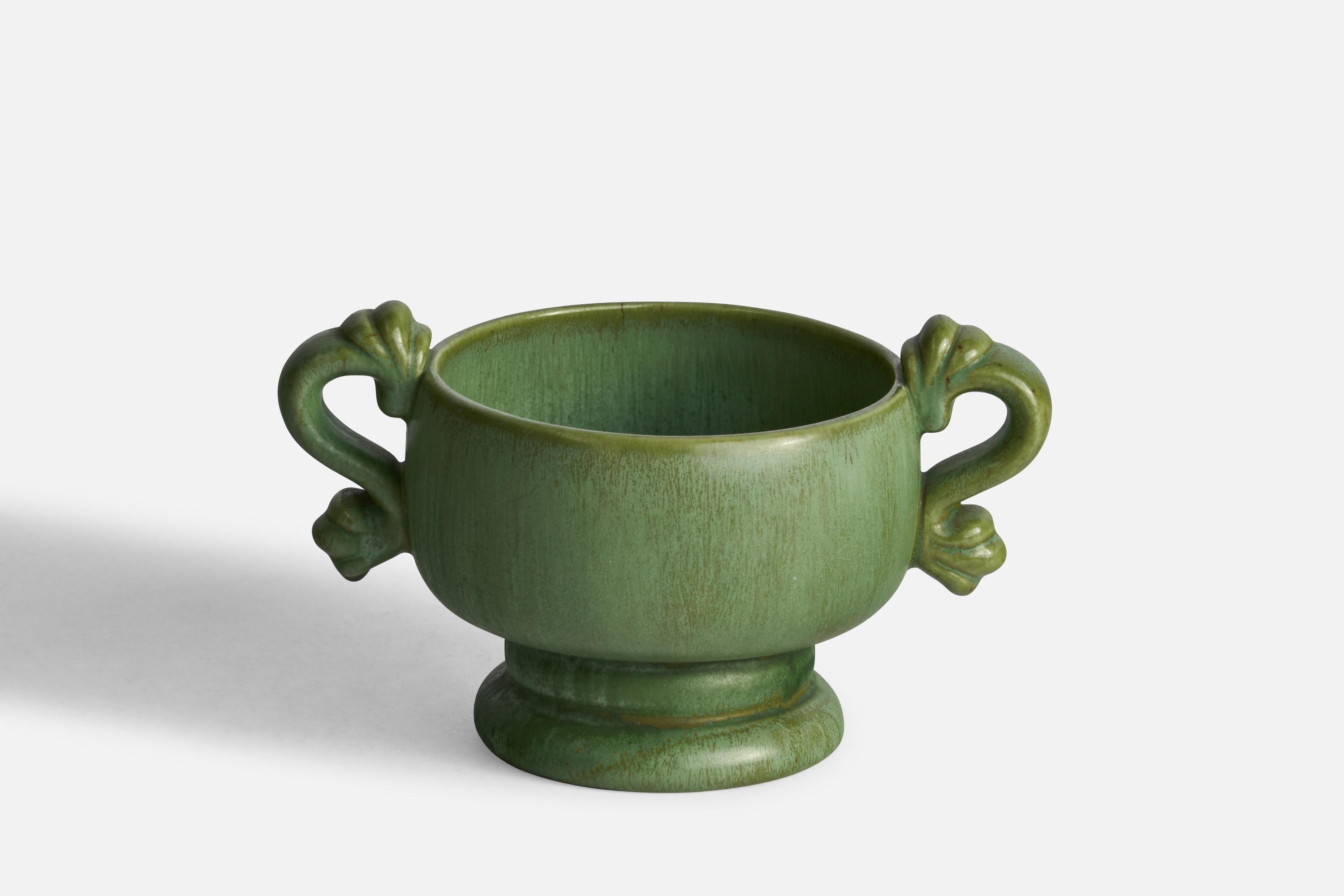 A green-glazed ceramic bowl designed by Arthur Percy and produced by Gefle, Sweden, c. 1930s.