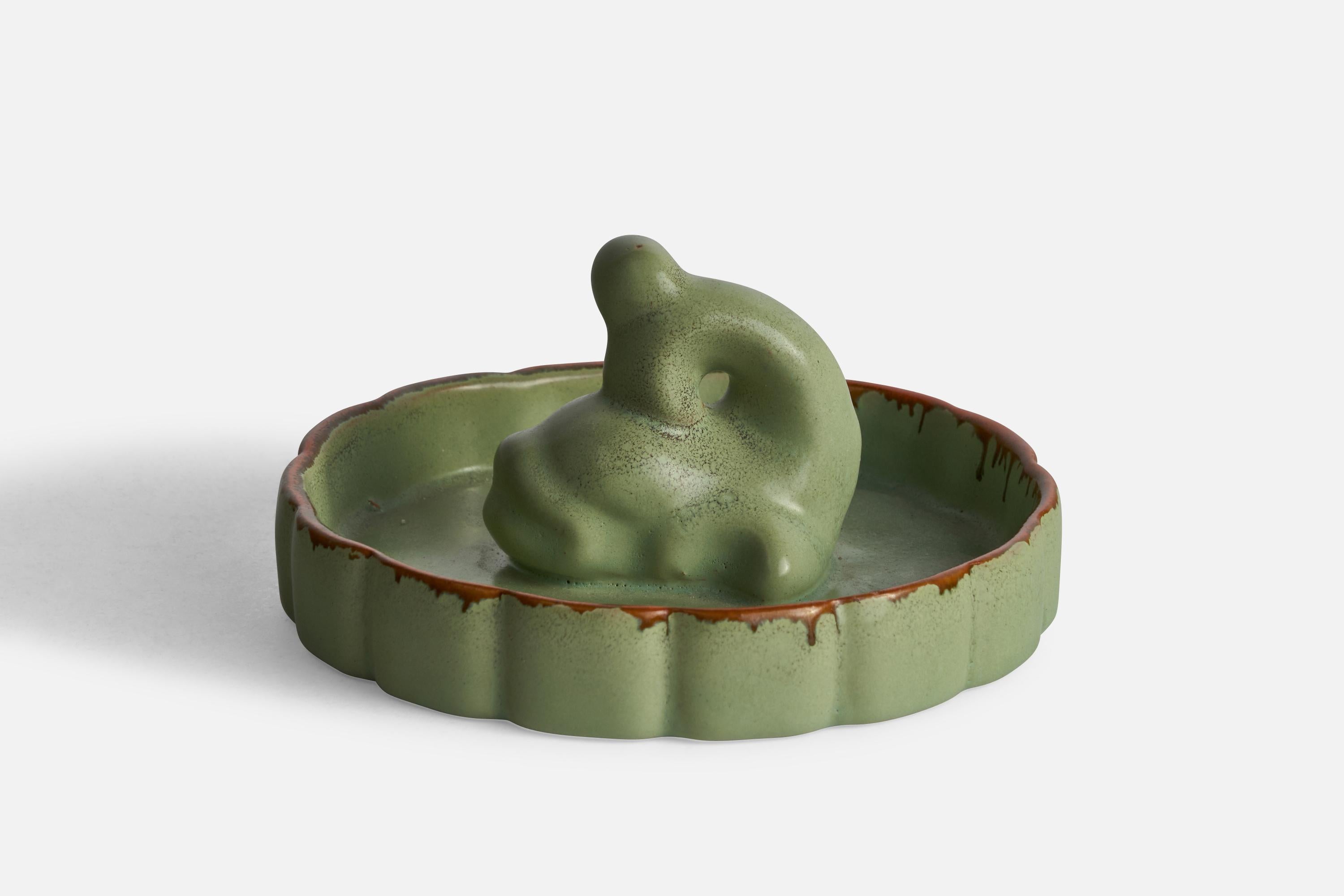 A green-glazed ceramic dish or vide-poche designed by Arthur Percy and produced by Gefle, Sweden, c. 1930s.